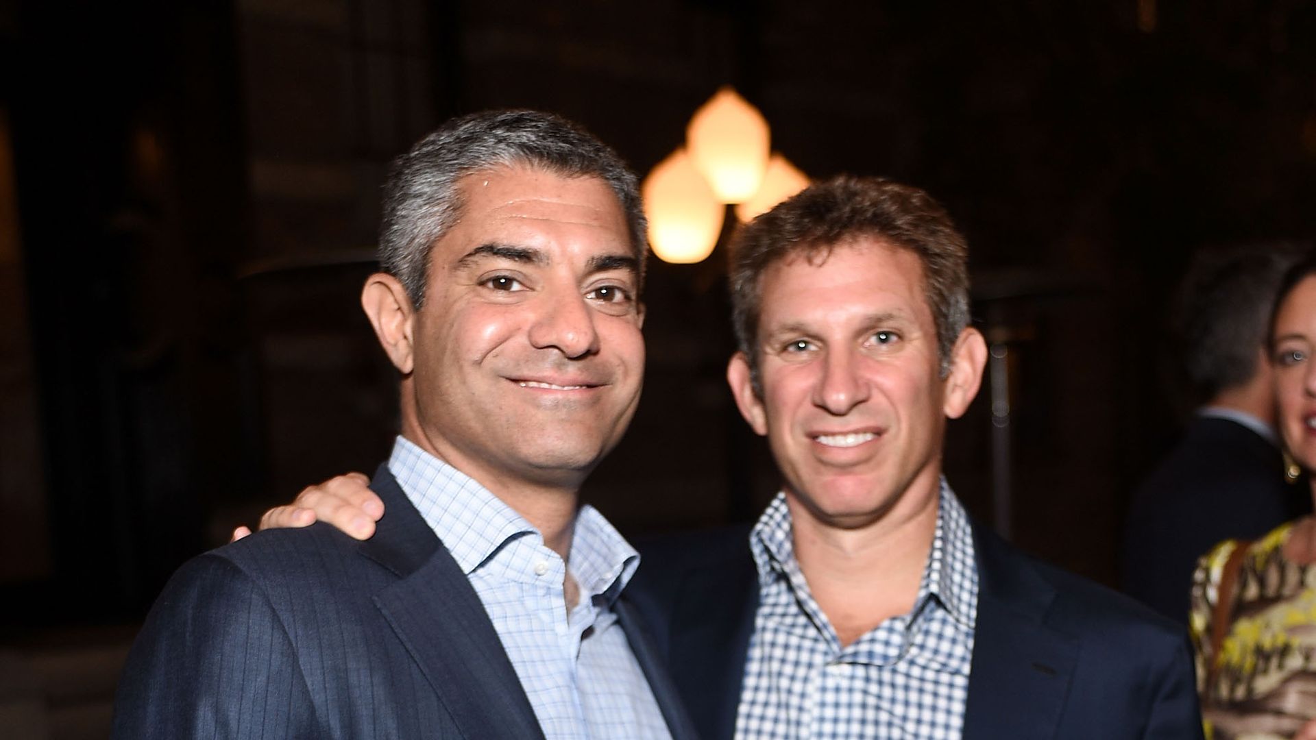 Two Moelis bankers, Navid Mahmoodzadegan and Craig Wadler, stand side by side for a photo in Los Angeles in 2015
