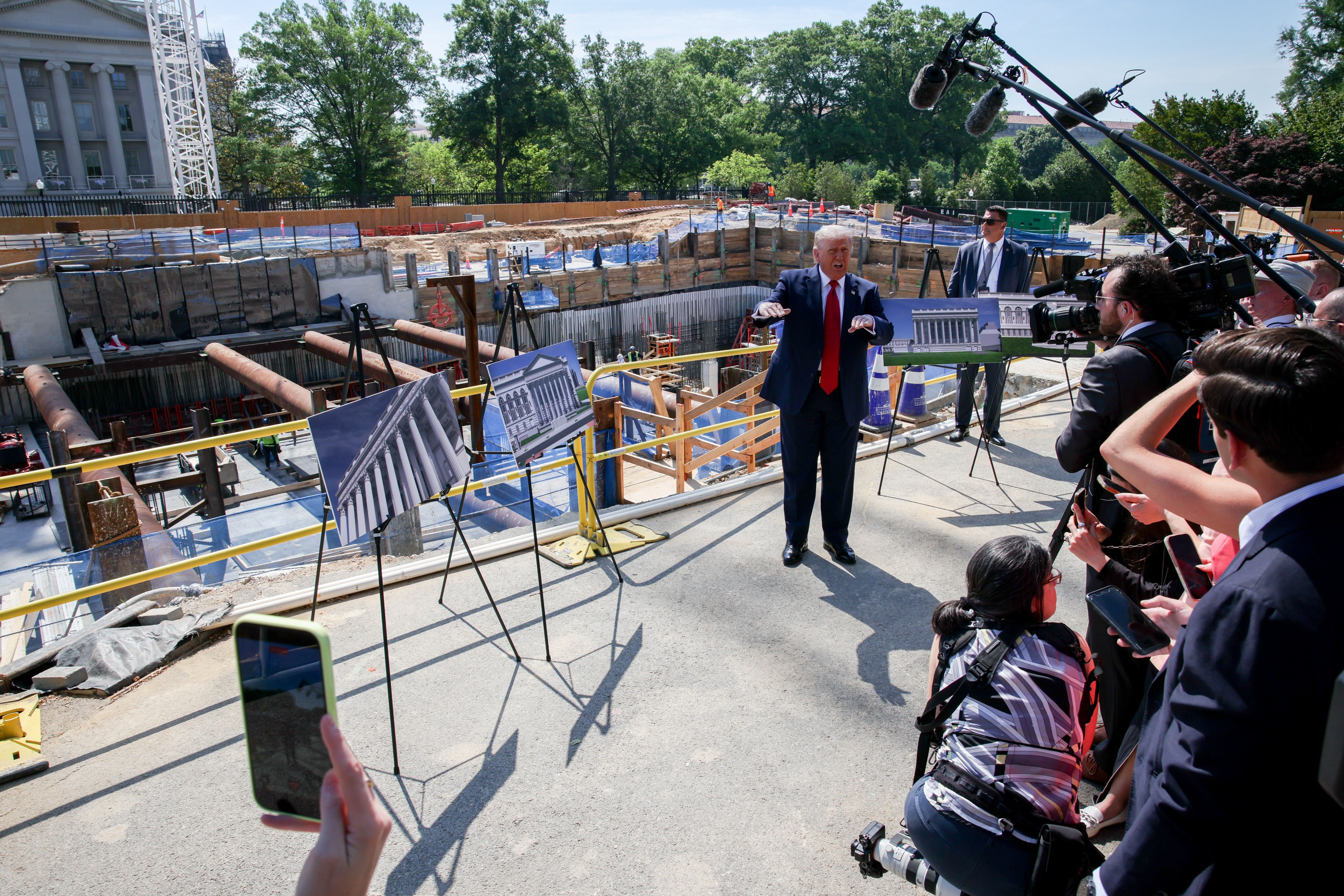 President Trump shows off White House ballroom construction plans this morning. Photo: Samuel Corum/Sipa/Bloomberg via Getty Images