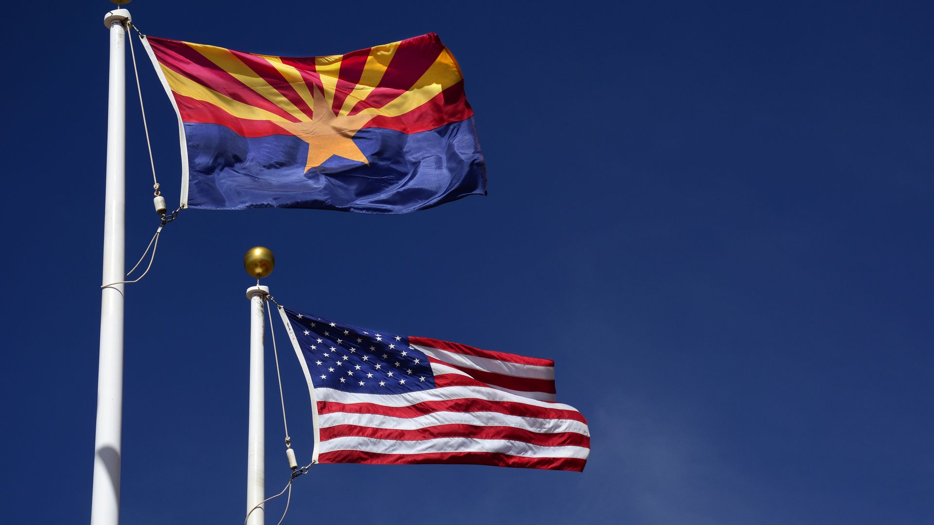 An Arizona and an American flag. 