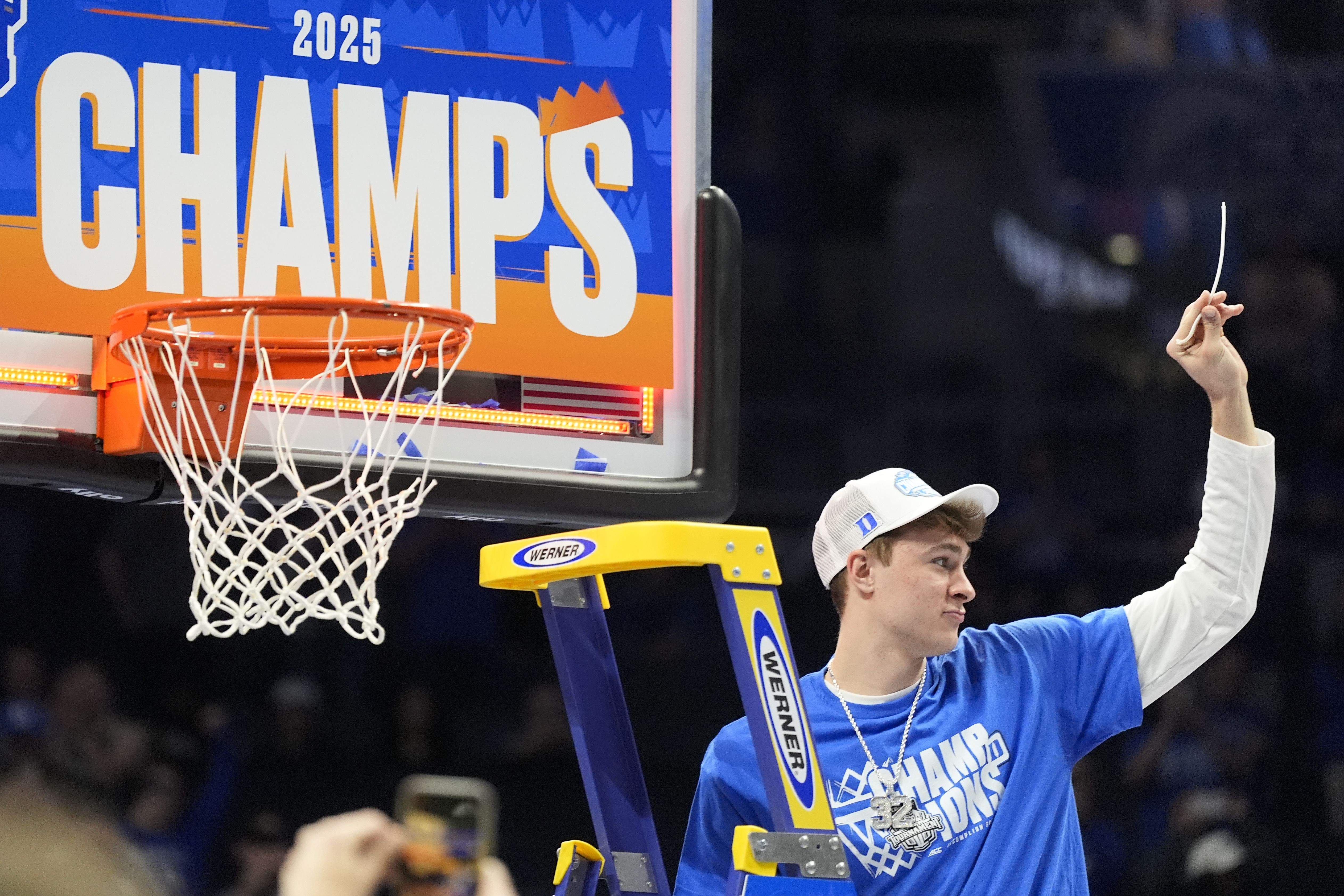 Duke's Cooper Flagg cuts the net after the Blue Devils beat Louisville in the ACC championship game on Saturday.