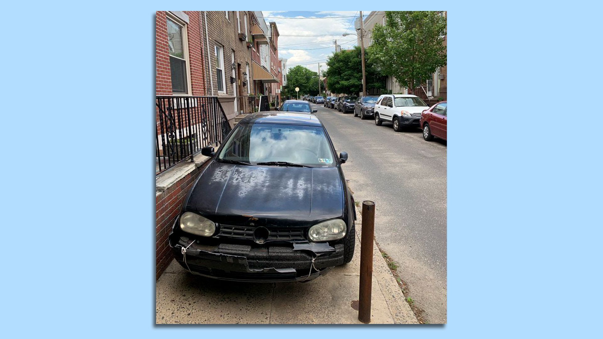 A car parks illegally on a curb in Philadelphia.