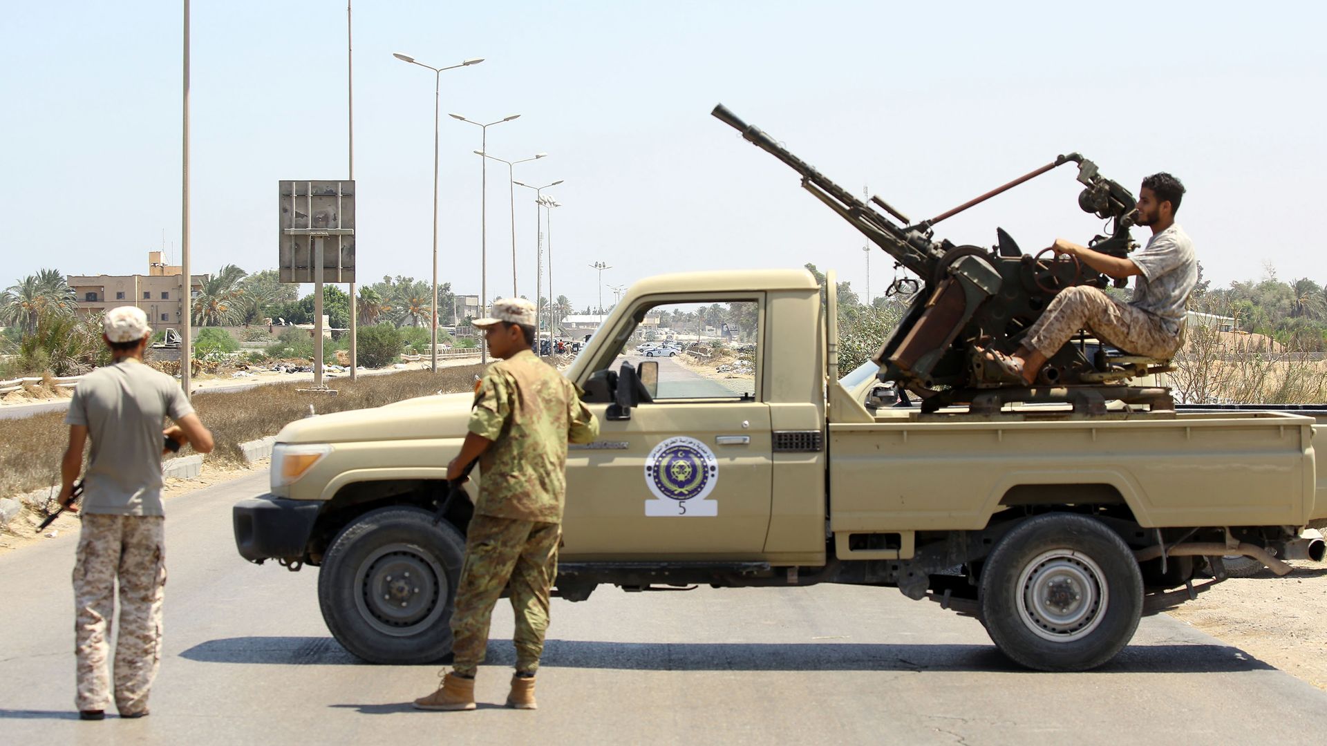 Man in truck with weapon