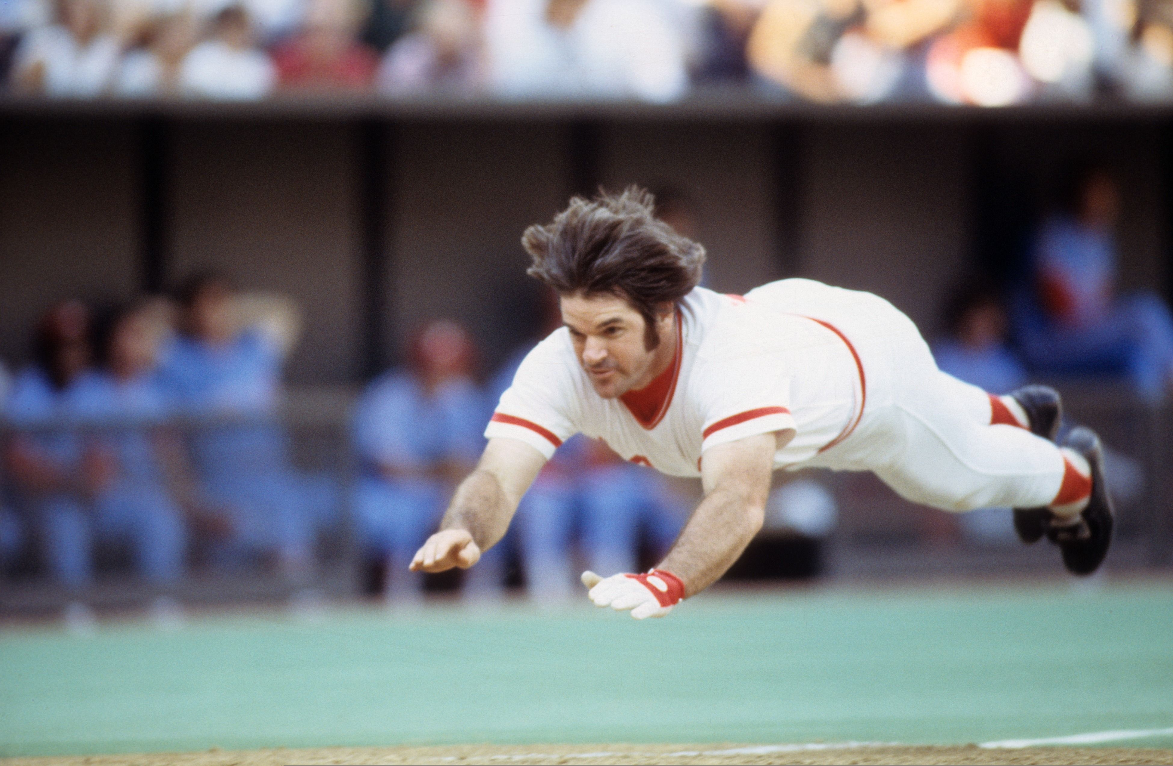 Pete Rose slides into home plate during a Cincinnati Reds game in 1978.