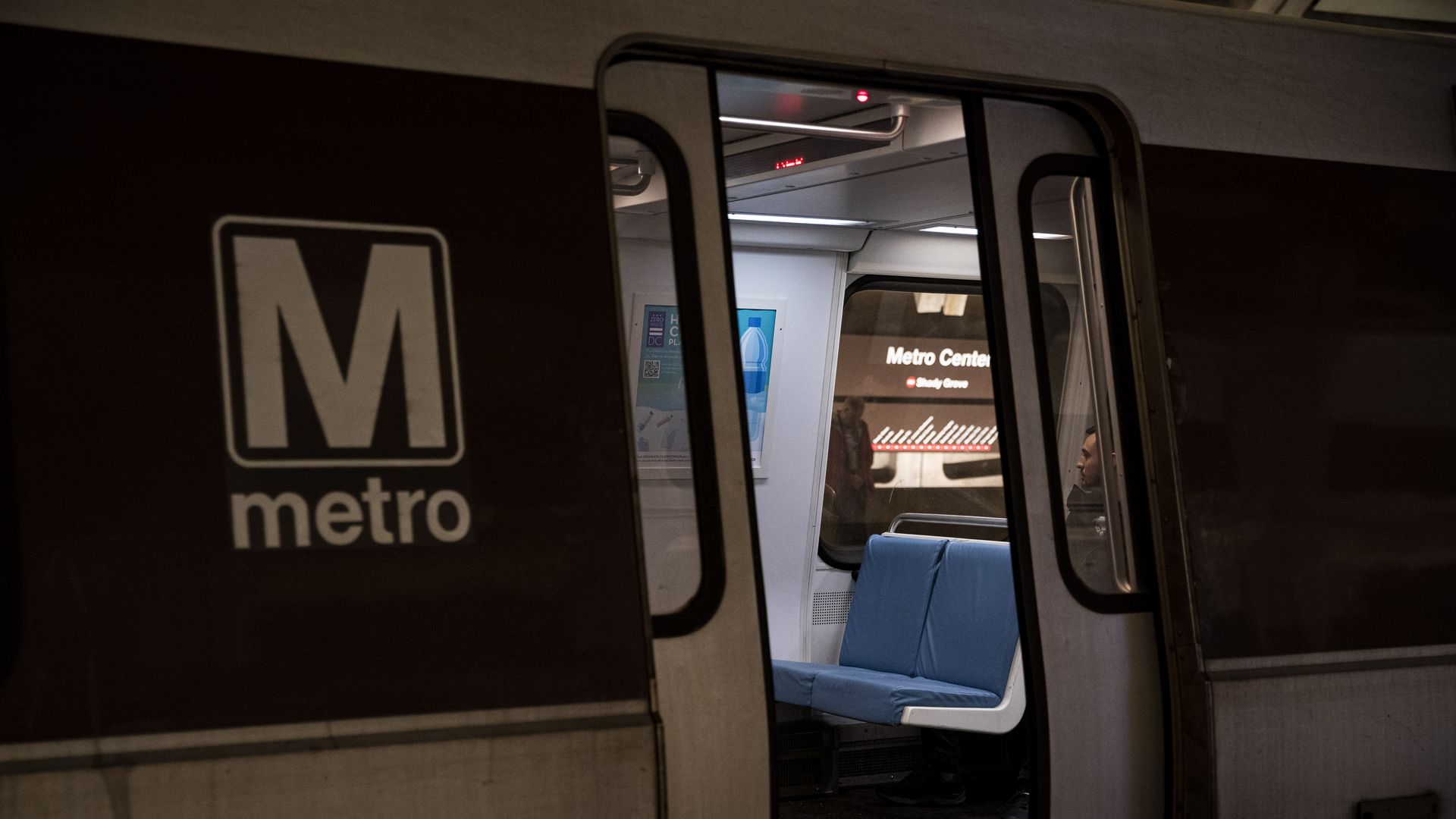 A Metro train car door opening at a station