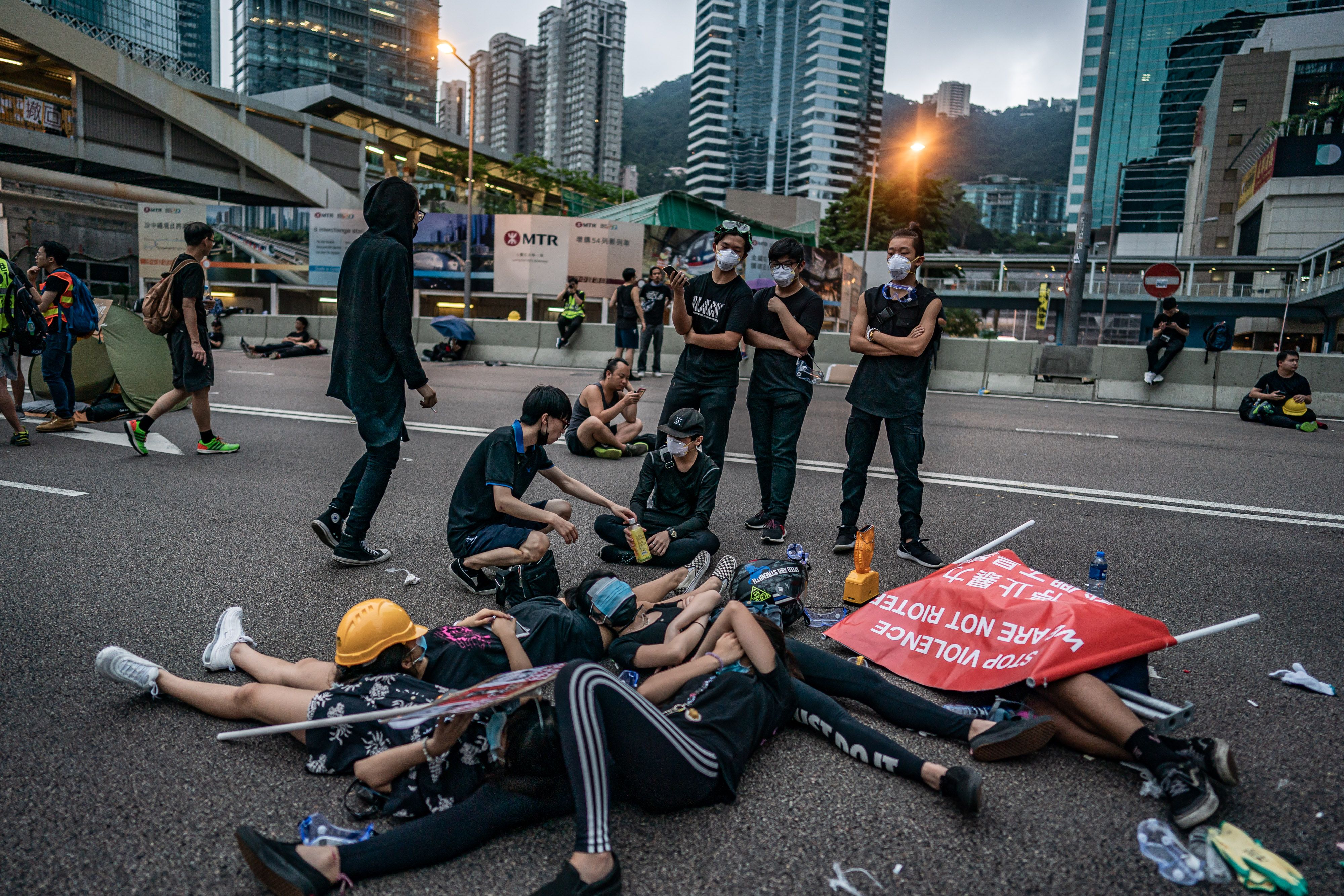 Protesters sleep on a highway after a demonstration against the now-suspended extradition bill on June 17, 2019 in Hong Kong China. 