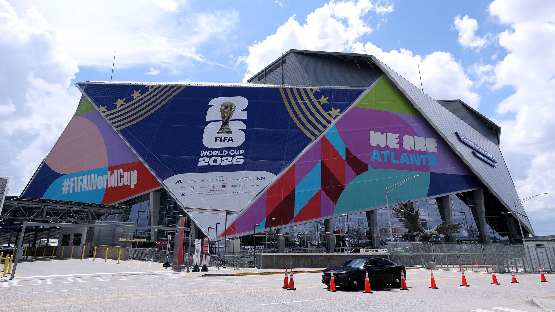 Modern stadium with colorful panels that read #FIFAWorldCup, "We Are Atlanta," and another panel featuring the 2026 FIFA World Cup logo