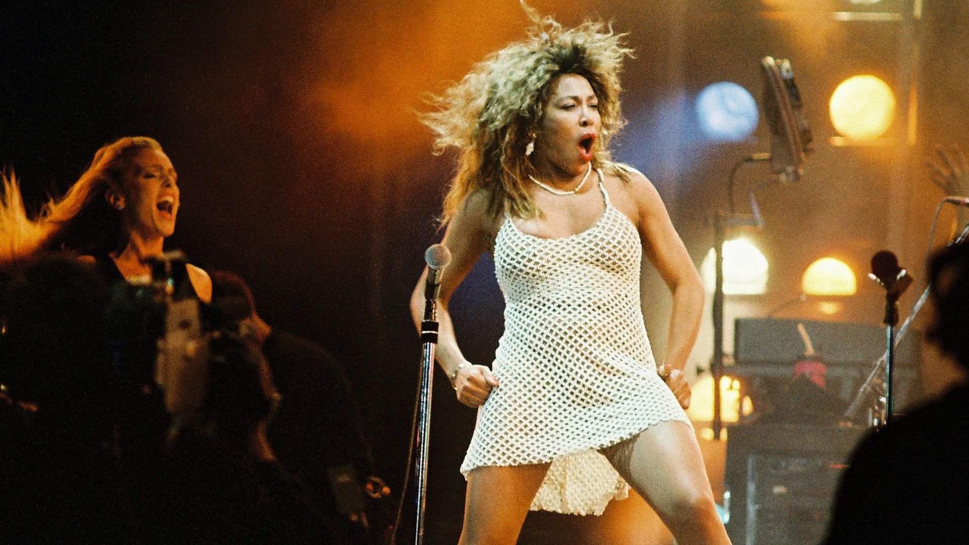 Tina Turner performs on stage. 