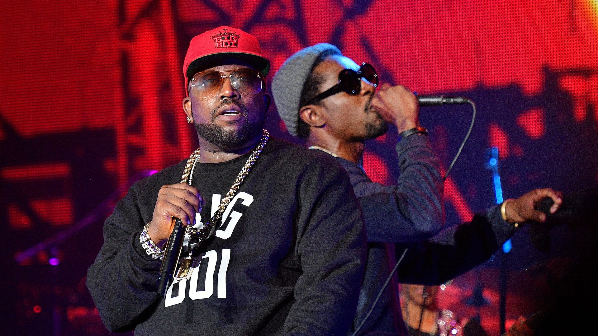 Big Boi and Andre 3000 of Outkast perform on stage.