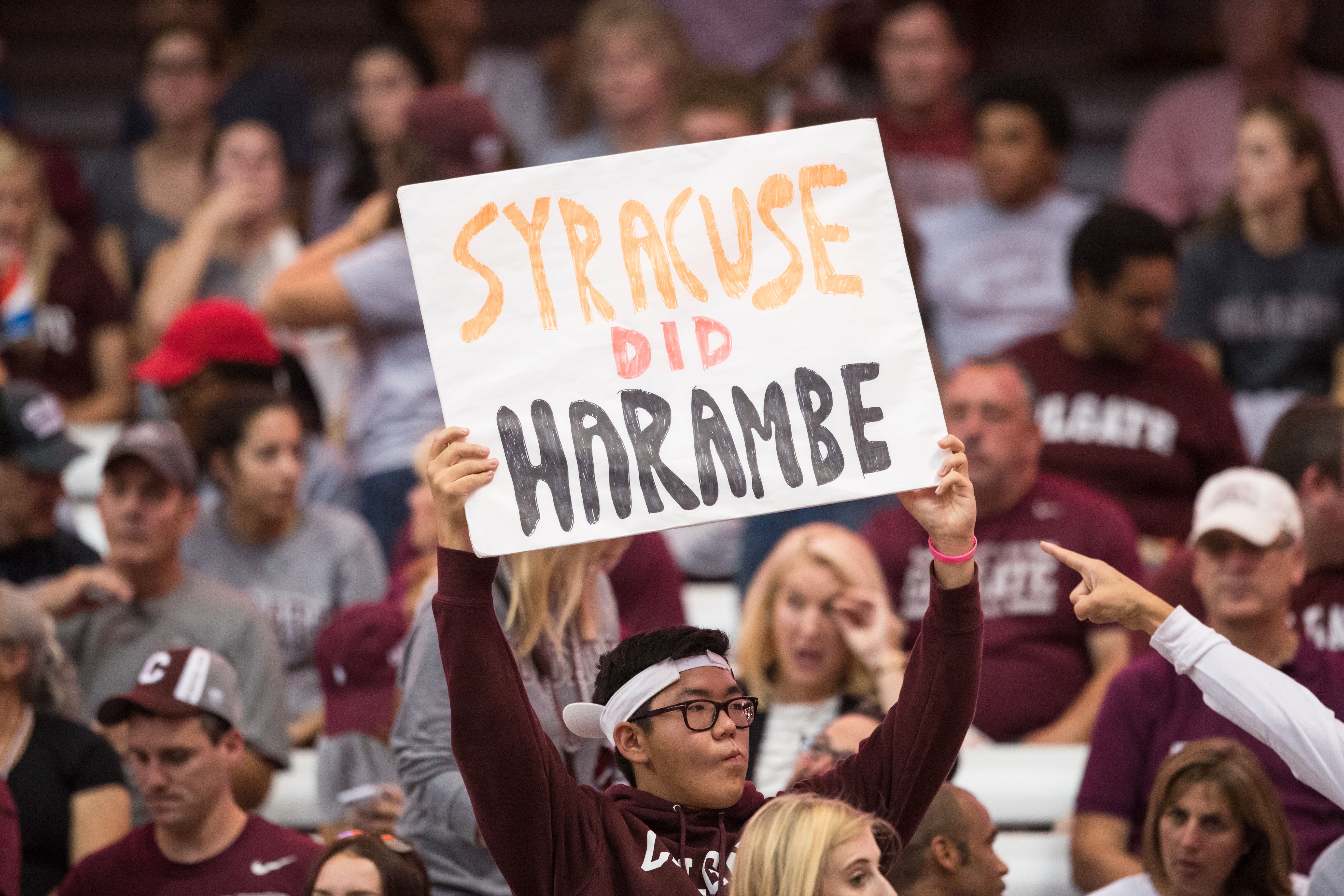A Colgate Raiders fan holds up a sign that reads "Syracuse did Harambe" during the game against the Syracuse Orange on September 2, 2016 at The Carrier Dome in Syracuse, New York.