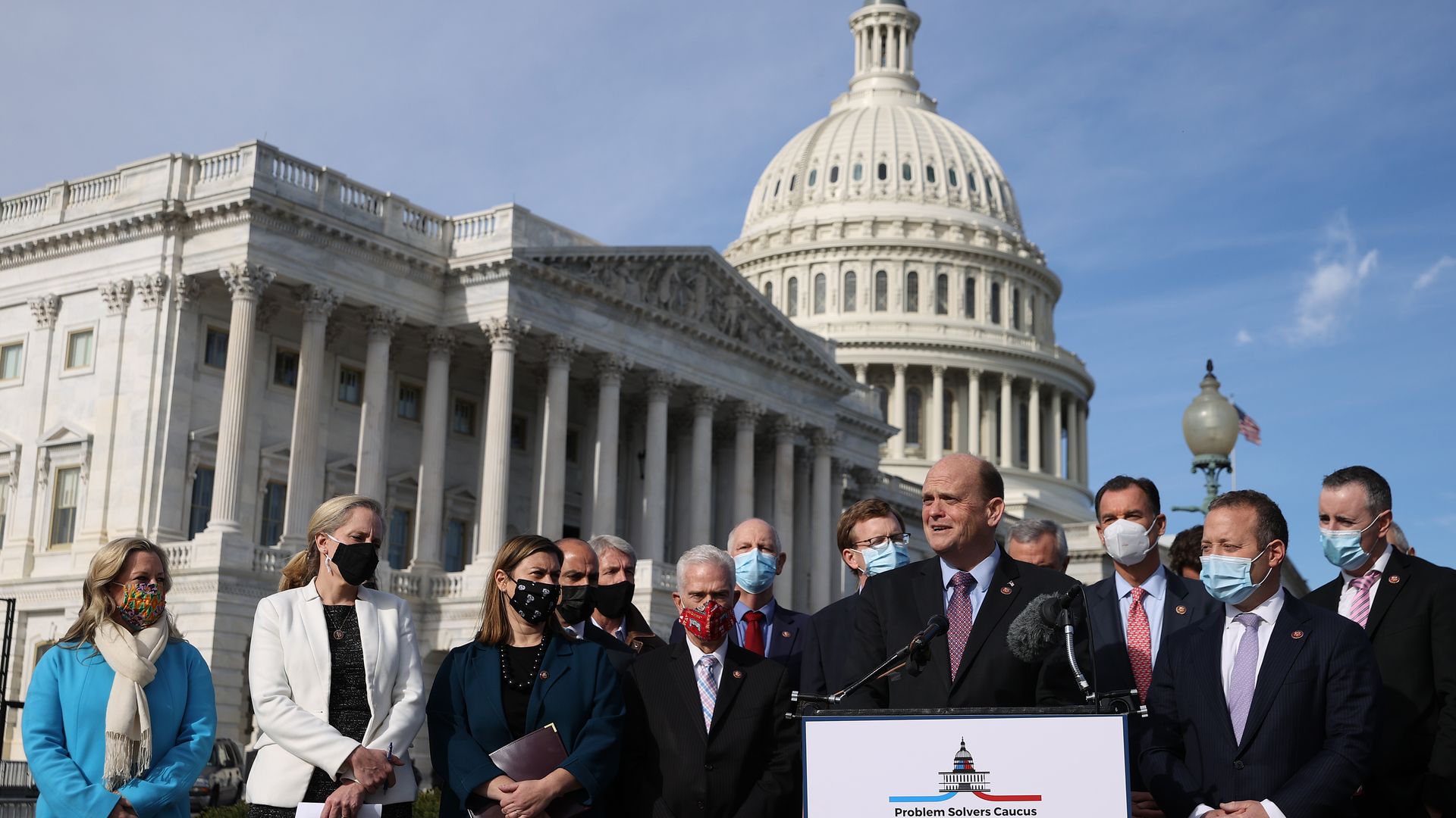 Reps. Tom Reed and Rep. Josh Gottheimer co-chairs of the bipartisan Problem Solvers Caucus, hold a news conference with fellow members of Congress in December in Washington, DC.