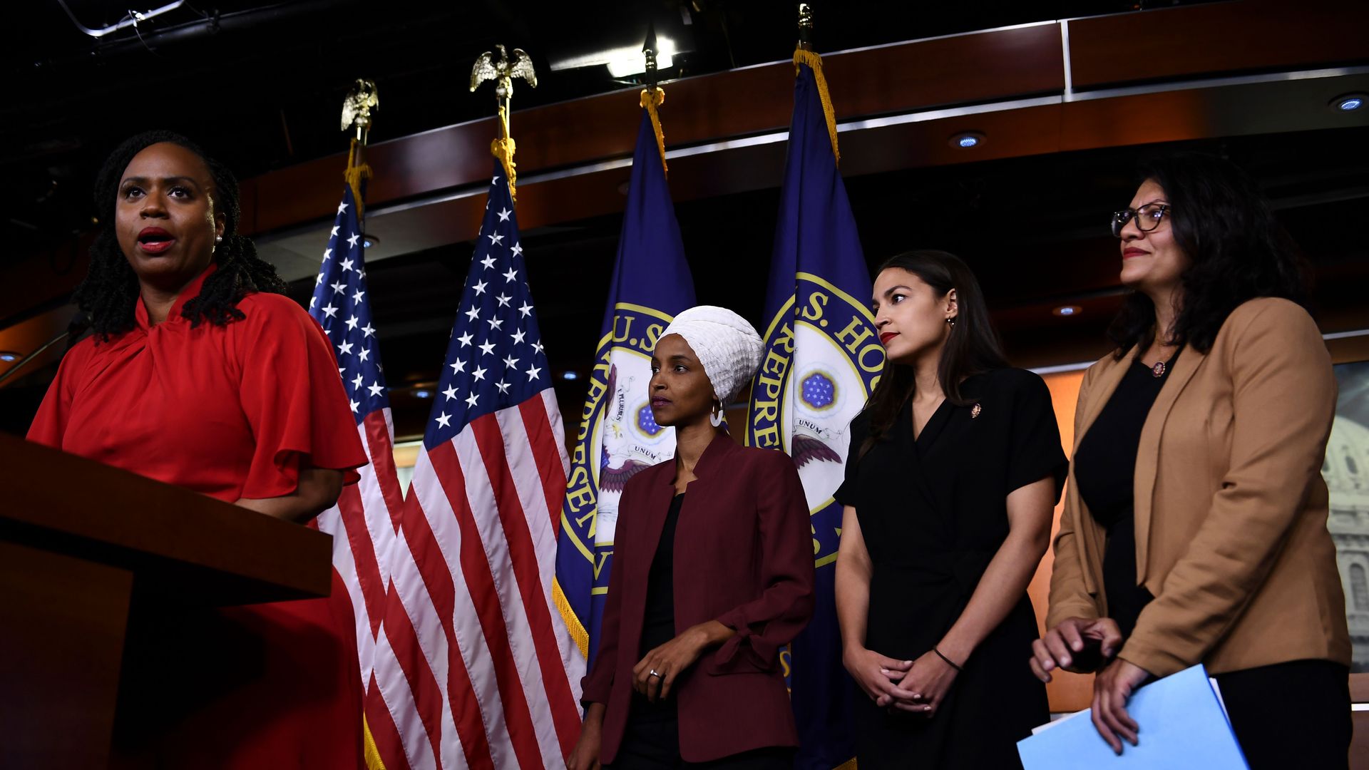The four women standing together on stage. 