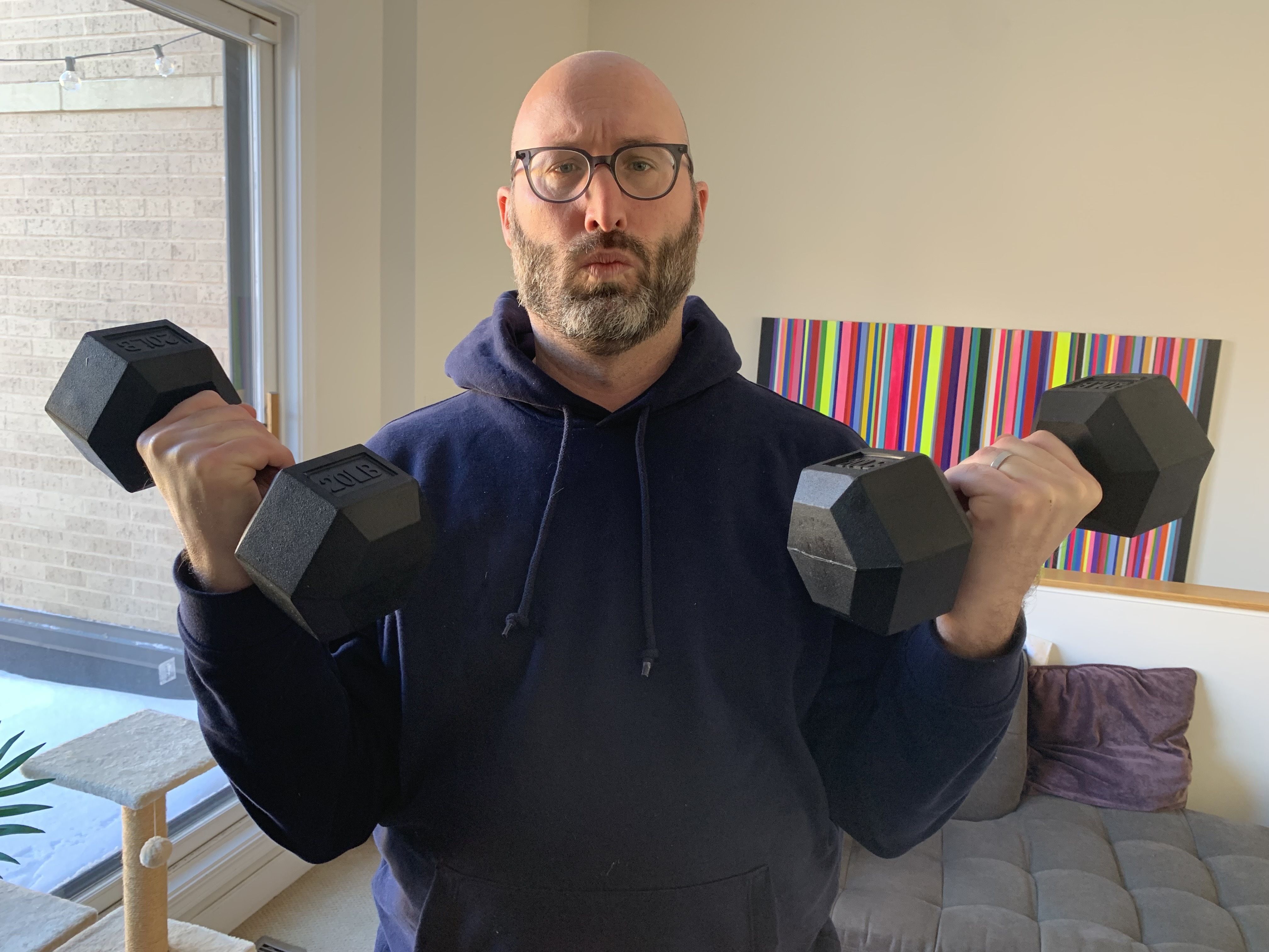 Photo of man lifting weights. 