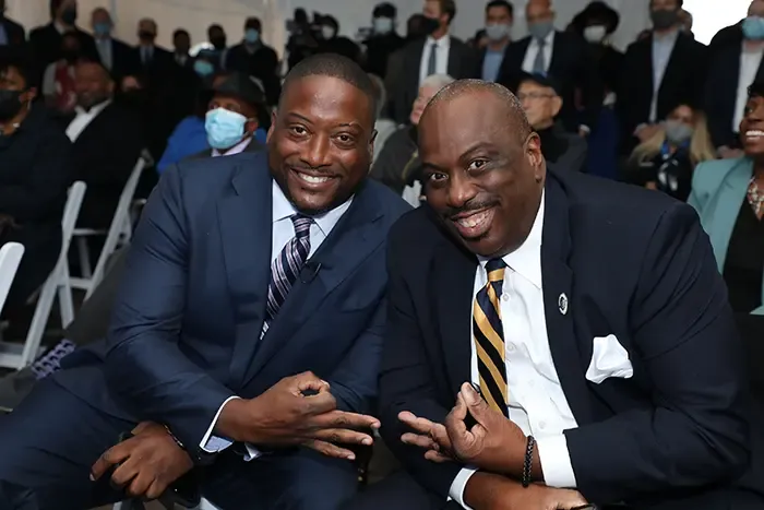 Christopher Dennis (left) and Charlotte City Council District 2 Rep. Malcolm Graham representing their fraternity, Kappa Alpha Psi at the JP Morgan Chase grand opening. Photo: Kevin Douglas / Captured by Kevin 