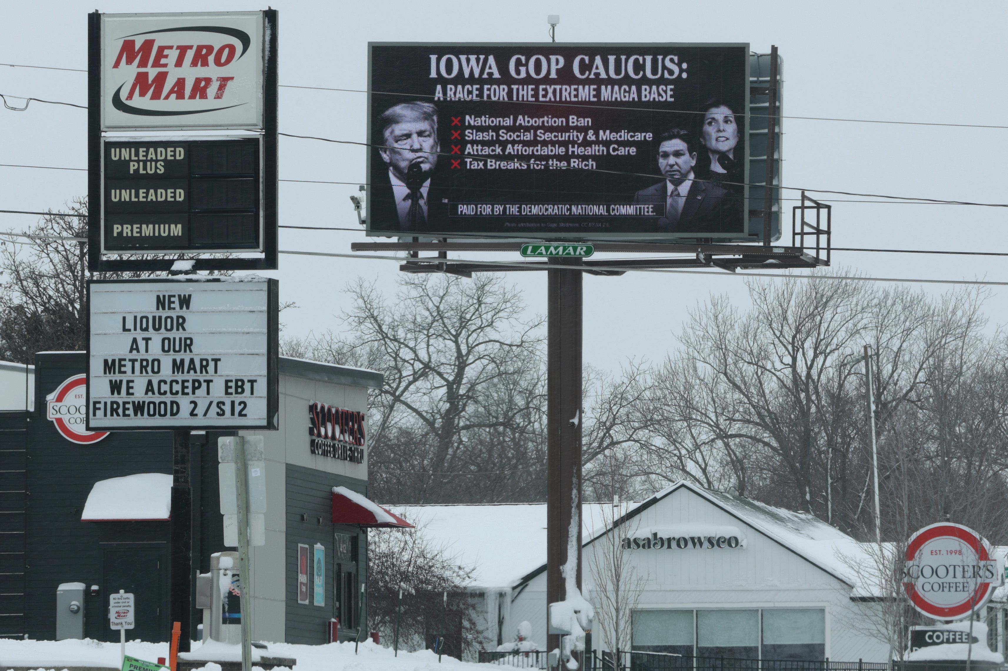 A digital billboard critical of the Republican presidential candidates stands in blizzard conditions in Cedar Falls, Iowa. 