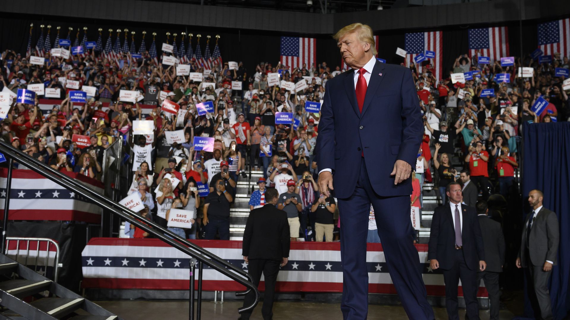 Former President Donald Trump enters the stage at a Save America Rally,.