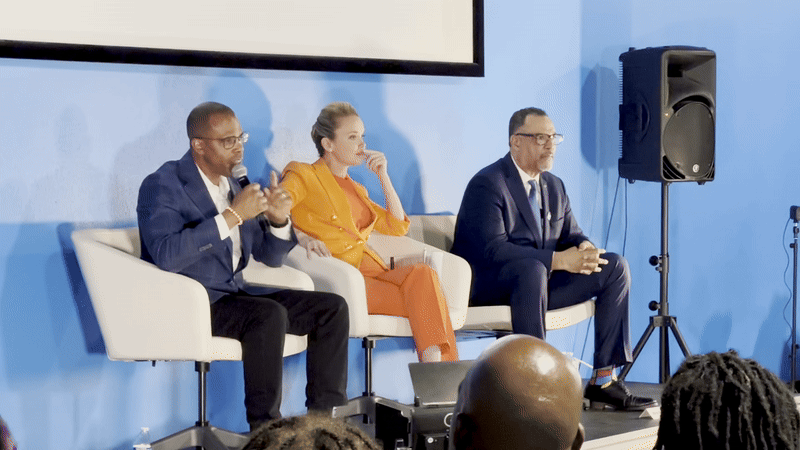 Image shows Arthur Hunter, Helena Moreno and Oliver Thomas talking on stage.