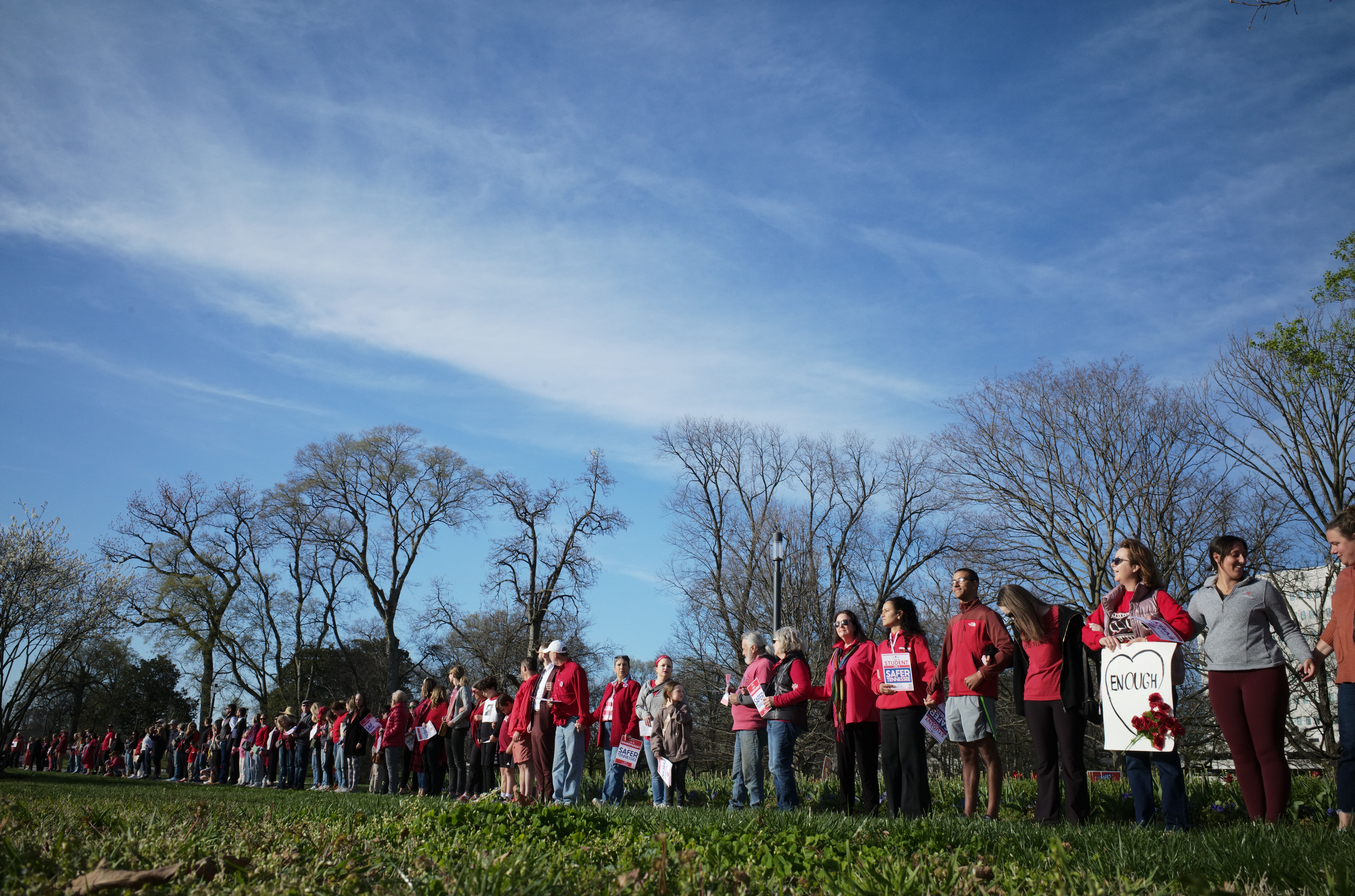 People linking arms in a line.