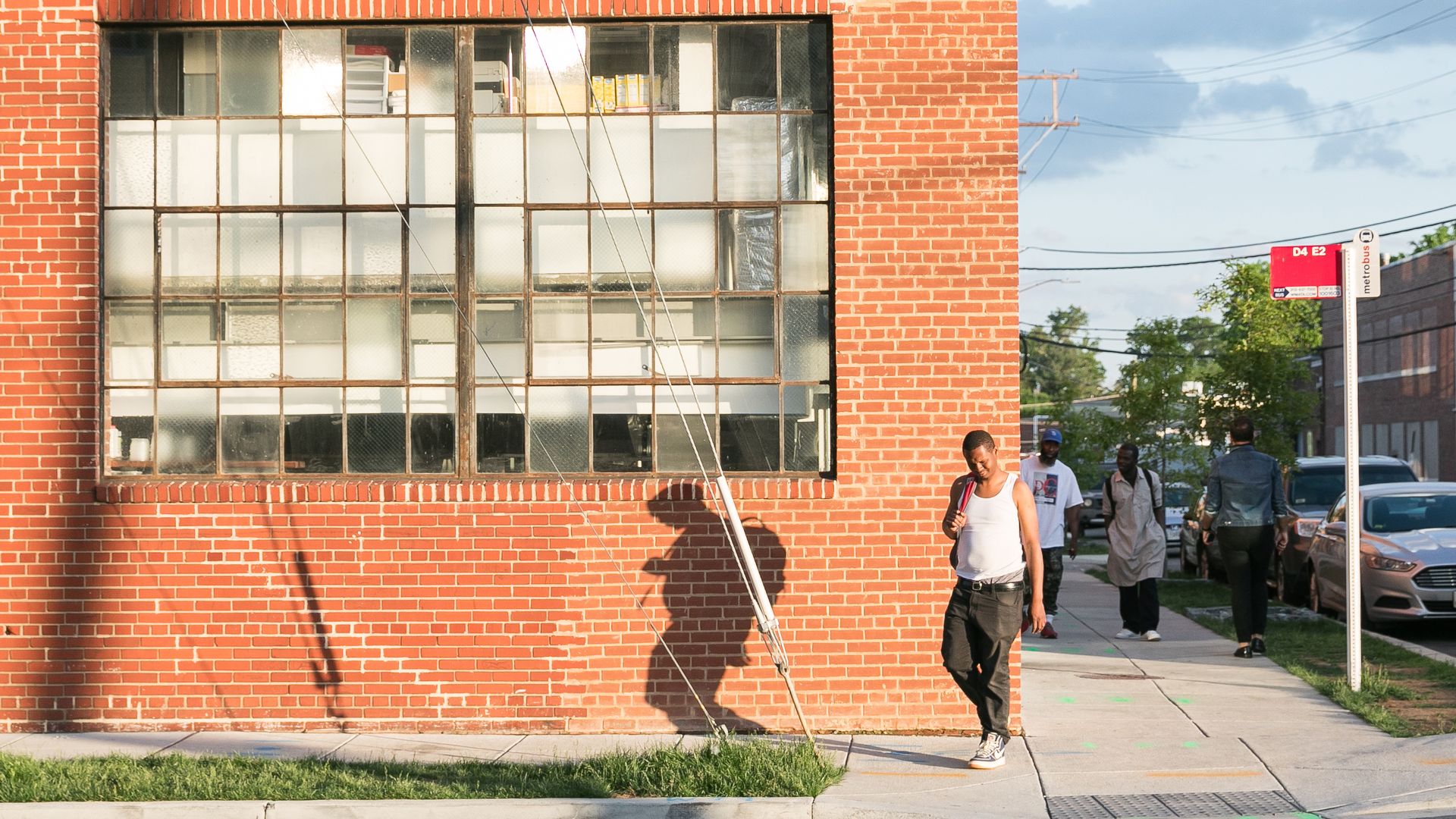 A man walks in front of Gravitas in Ivy City.