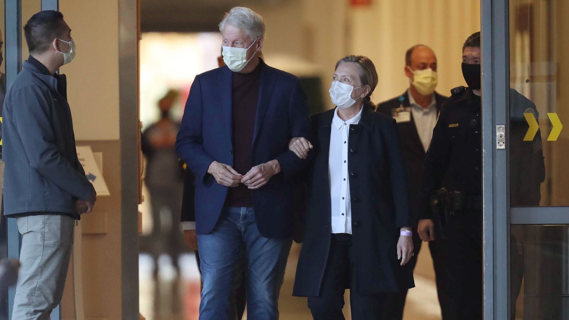 Former President Clinton and his wife, Hillary Rodham Clinton. are seen leaving a Los Angeles-area hospital.