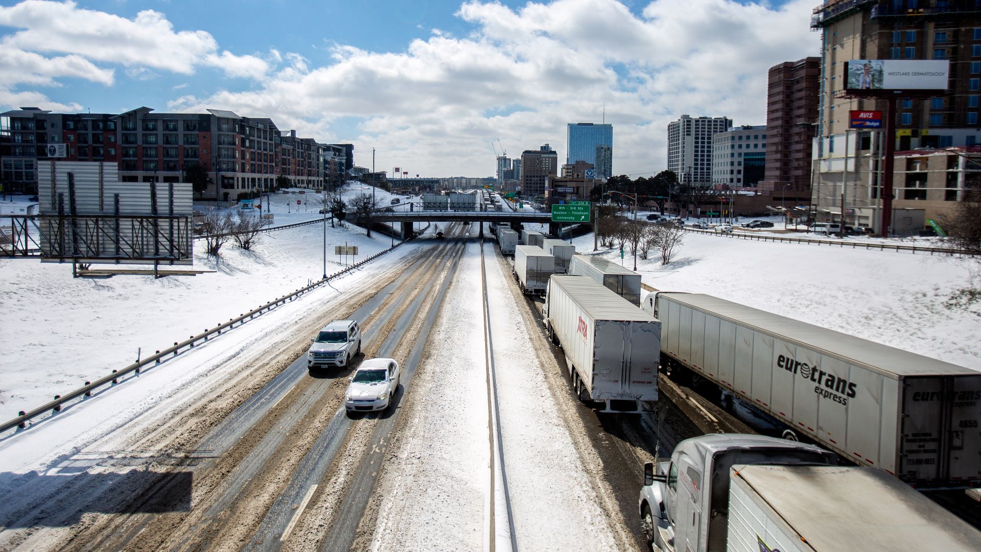 Long-haul trucks waiting in traffic caused by historic cold weather in Austin, Texas, on Feb. 15.
