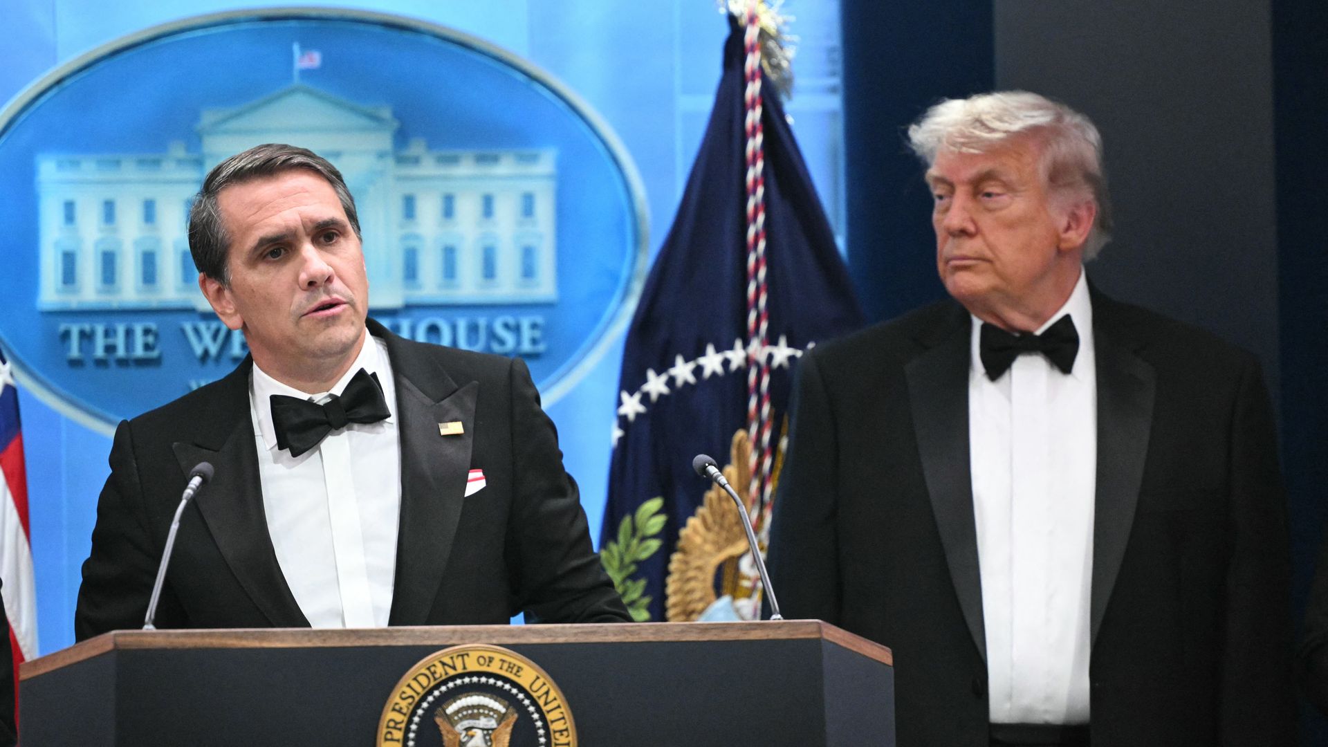 Attorney General Todd Blanche speaks as US President Donald Trump listens during a press briefing in the Brady Briefing Room at the White House in Washington, DC, shortly after a shooting incident at the White House Correspondents' Dinner on April 25, 2026.