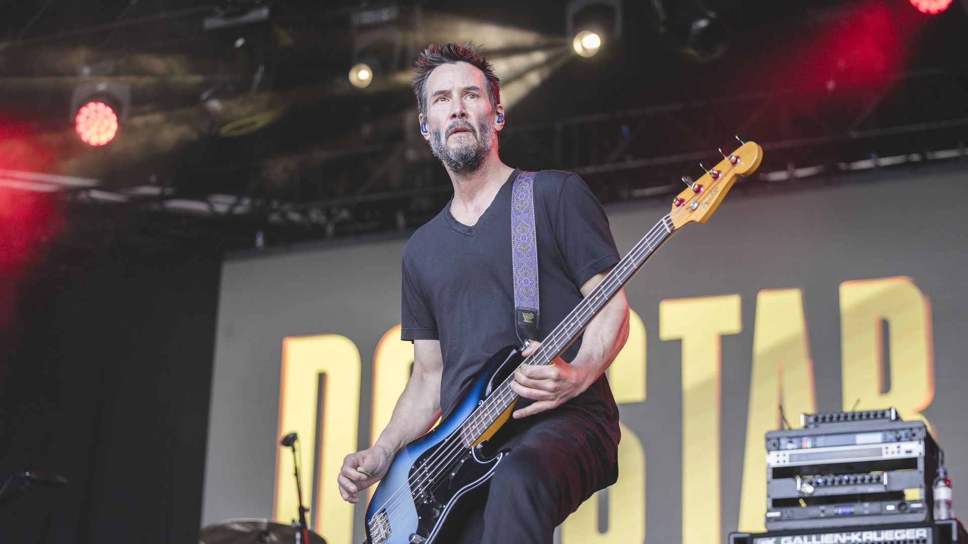 Keanu Reeves plays bass onstage.