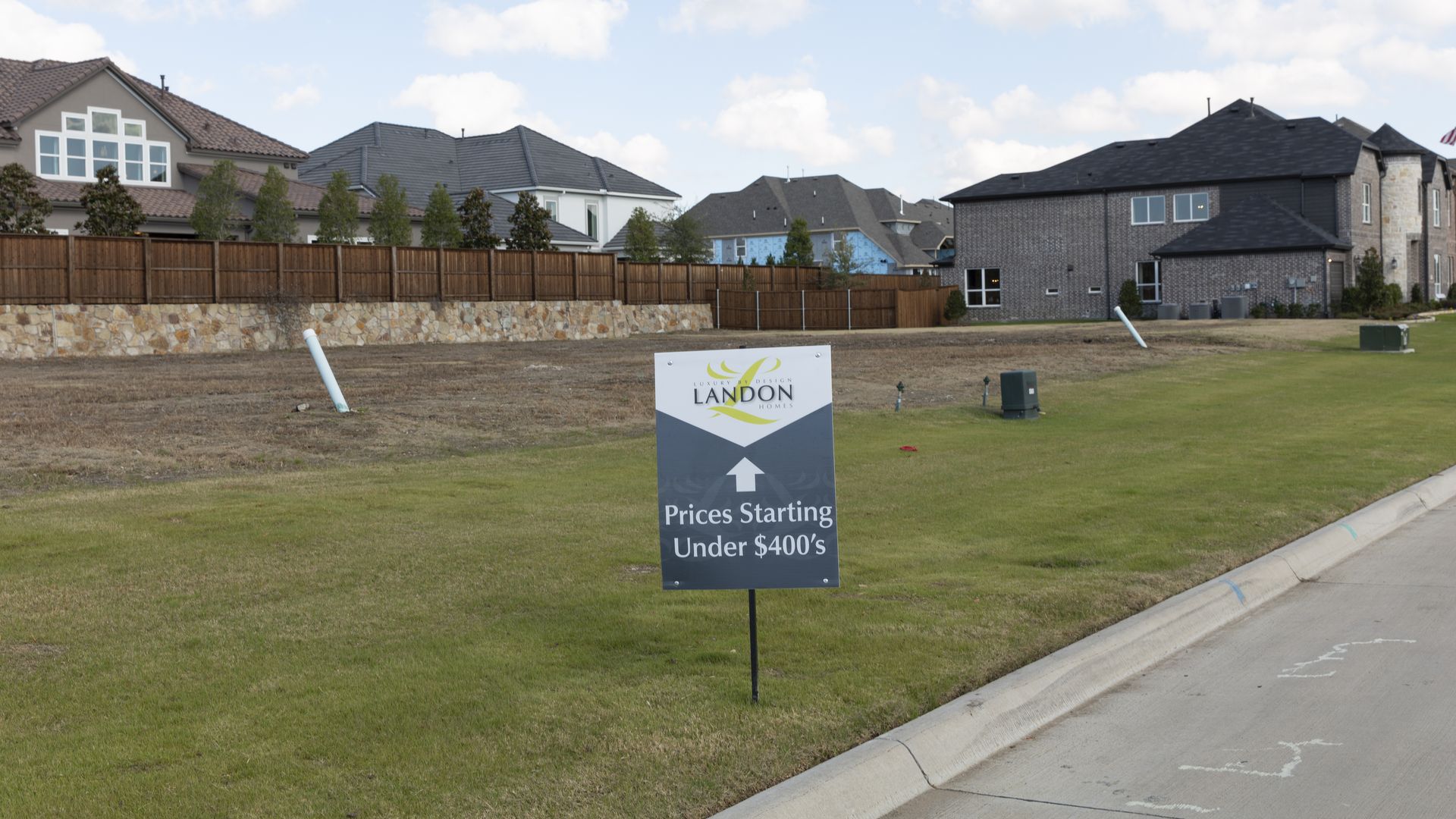 An empty lot where a $400,000 house will go