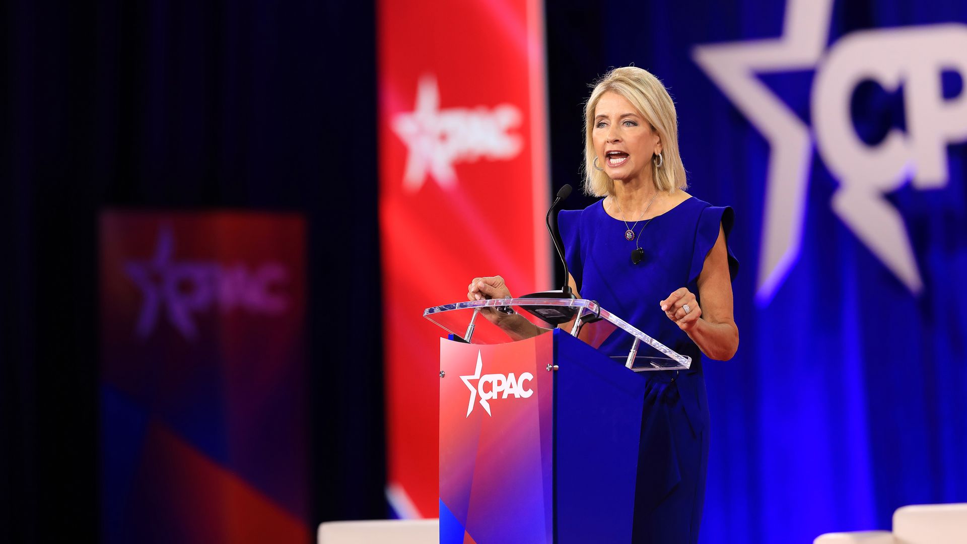 Photo of a woman behind the podium 