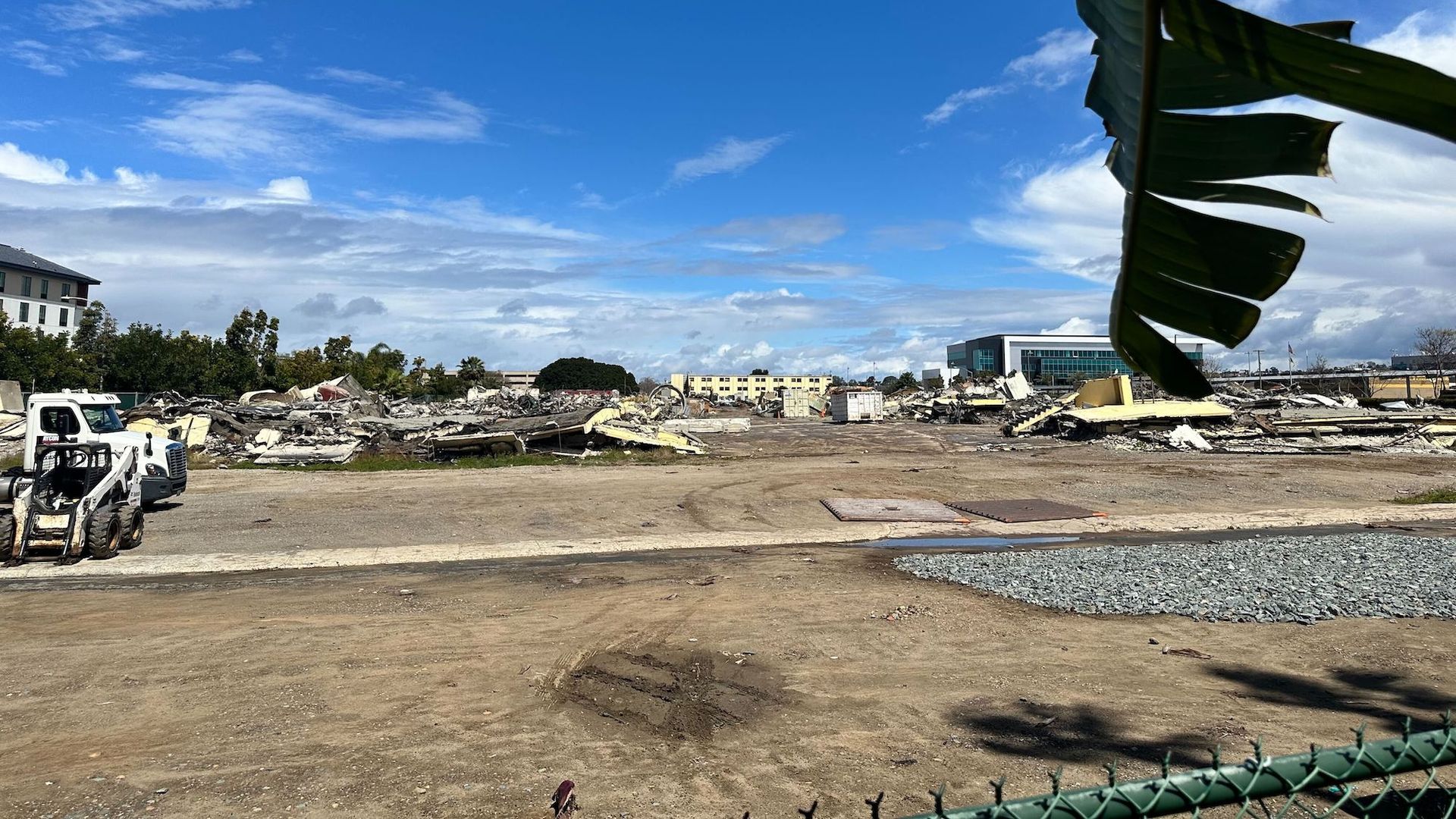 An empty dirt lot at a construction site.