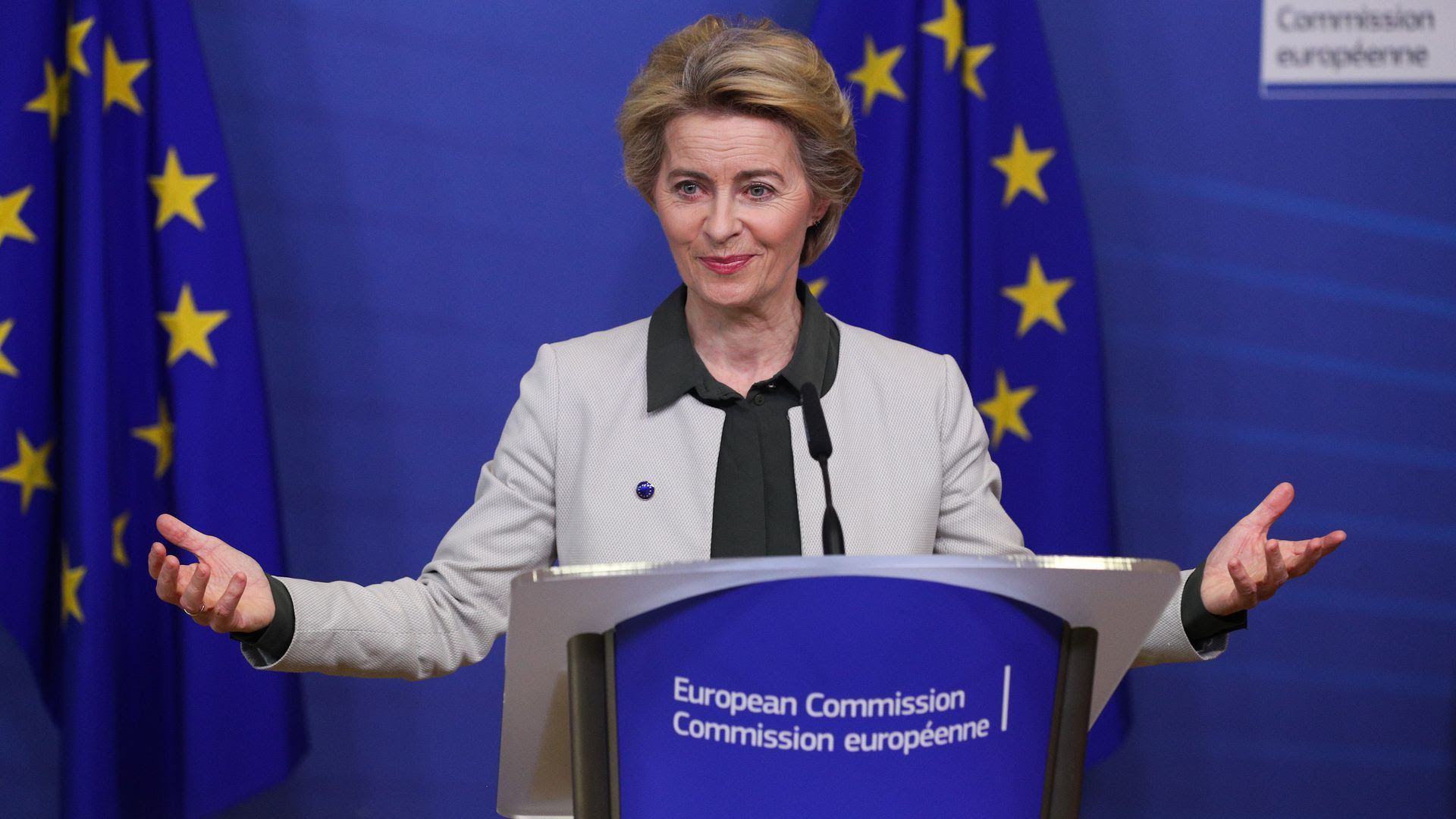 Ursula Von der Leyen stands at a podium.