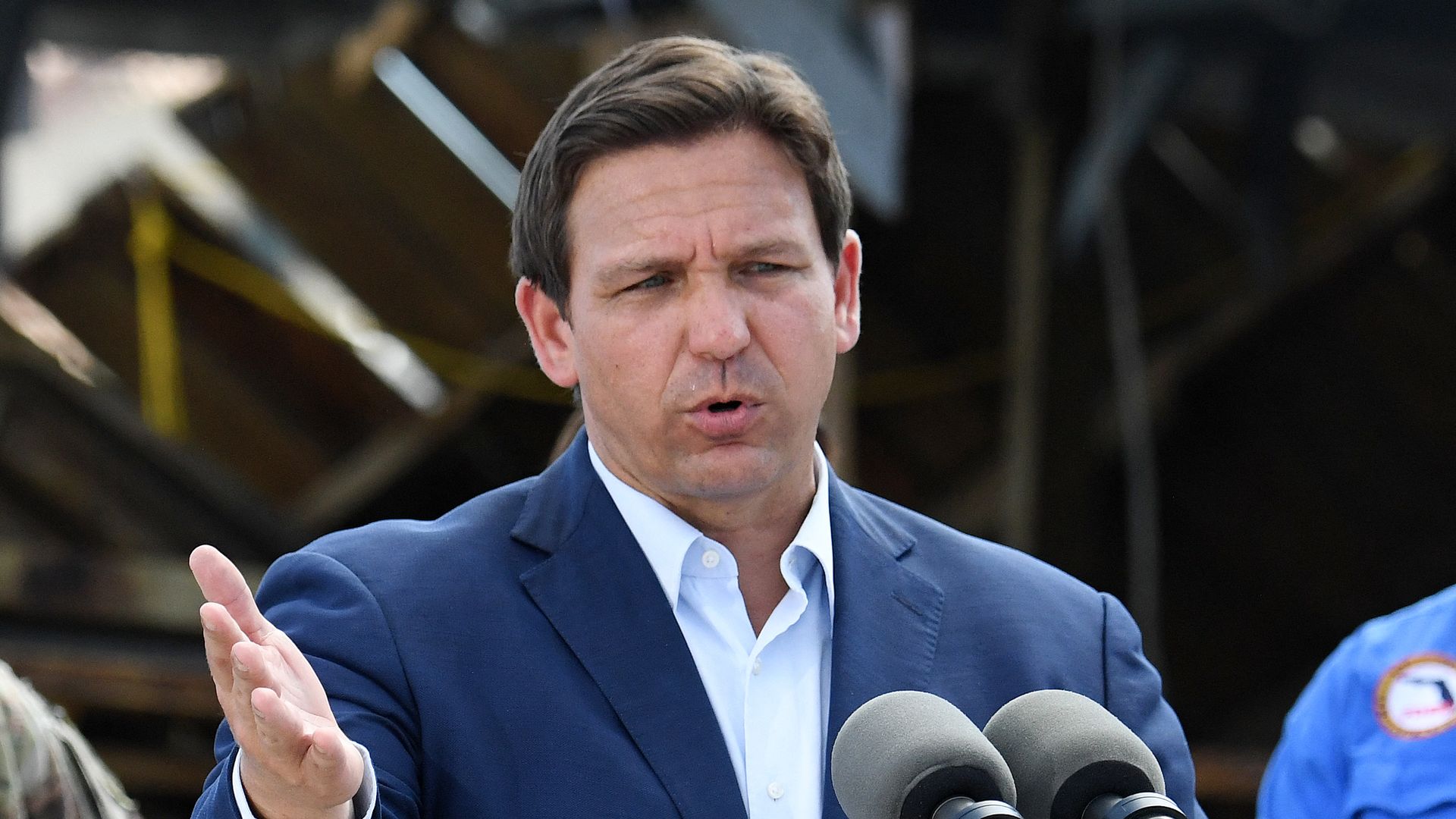 Florida Governor Ron DeSantis speaks in a neighborhood impacted by Hurricane Ian at Fisherman's Wharf in Fort Myers, Florida, on October 5.