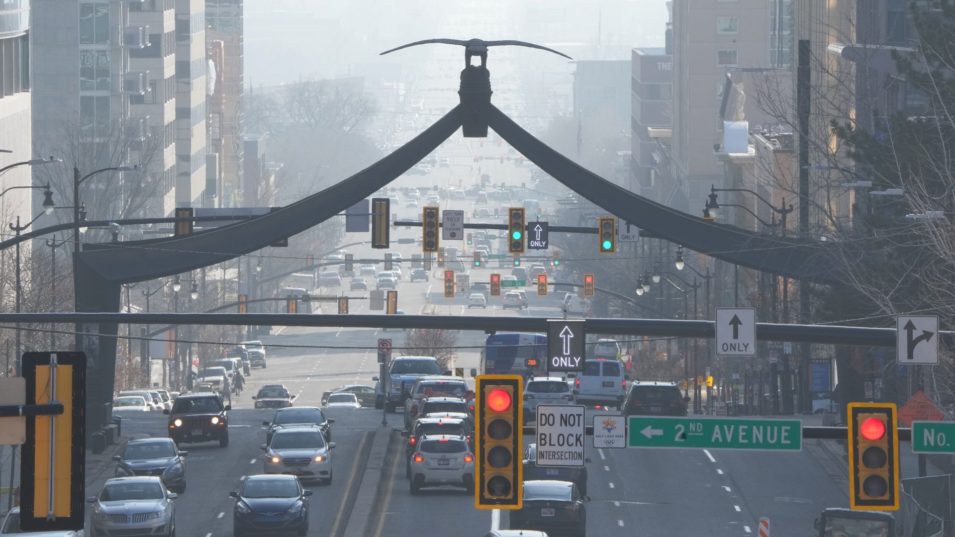 Traffic moves under a cloud of smog in downtown Salt Lake City.