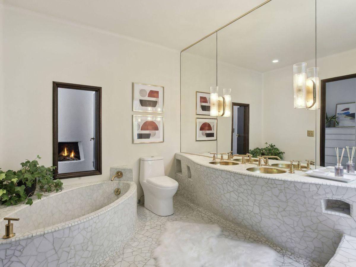 artistic mosaic bathroom with tub