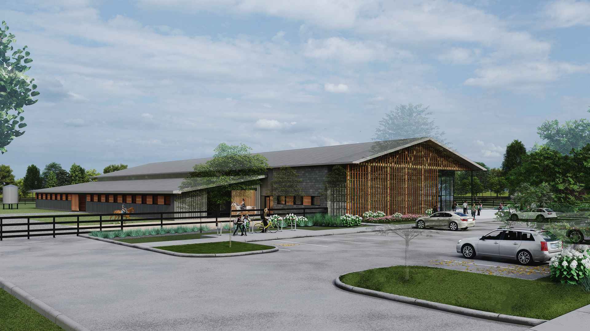 A rendering that shows a large building with stables, fenced off green space and a parking lot.