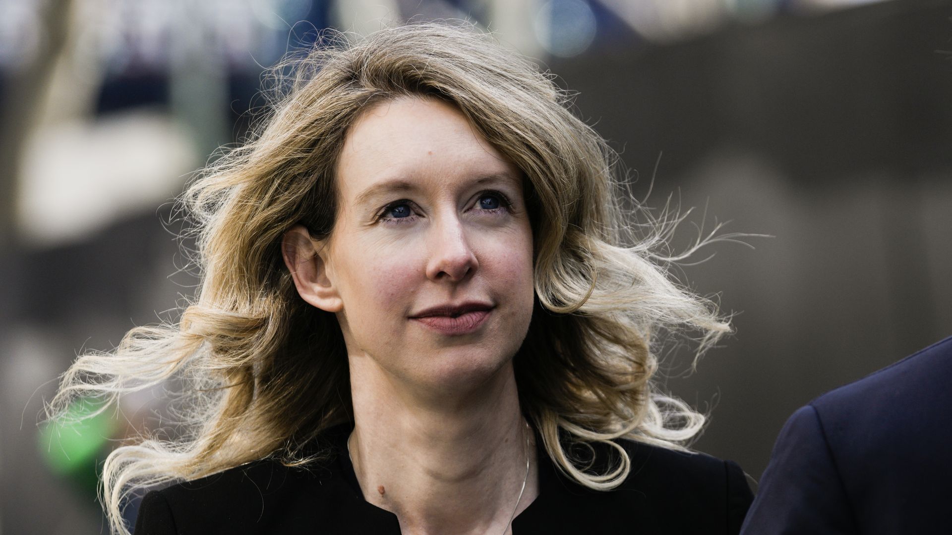 Former Theranos CEO Elizabeth Holmes walks back to her hotel following a hearing at the Robert E. Peckham U.S. Courthouse on March 17, 2023 in San Jose, California.