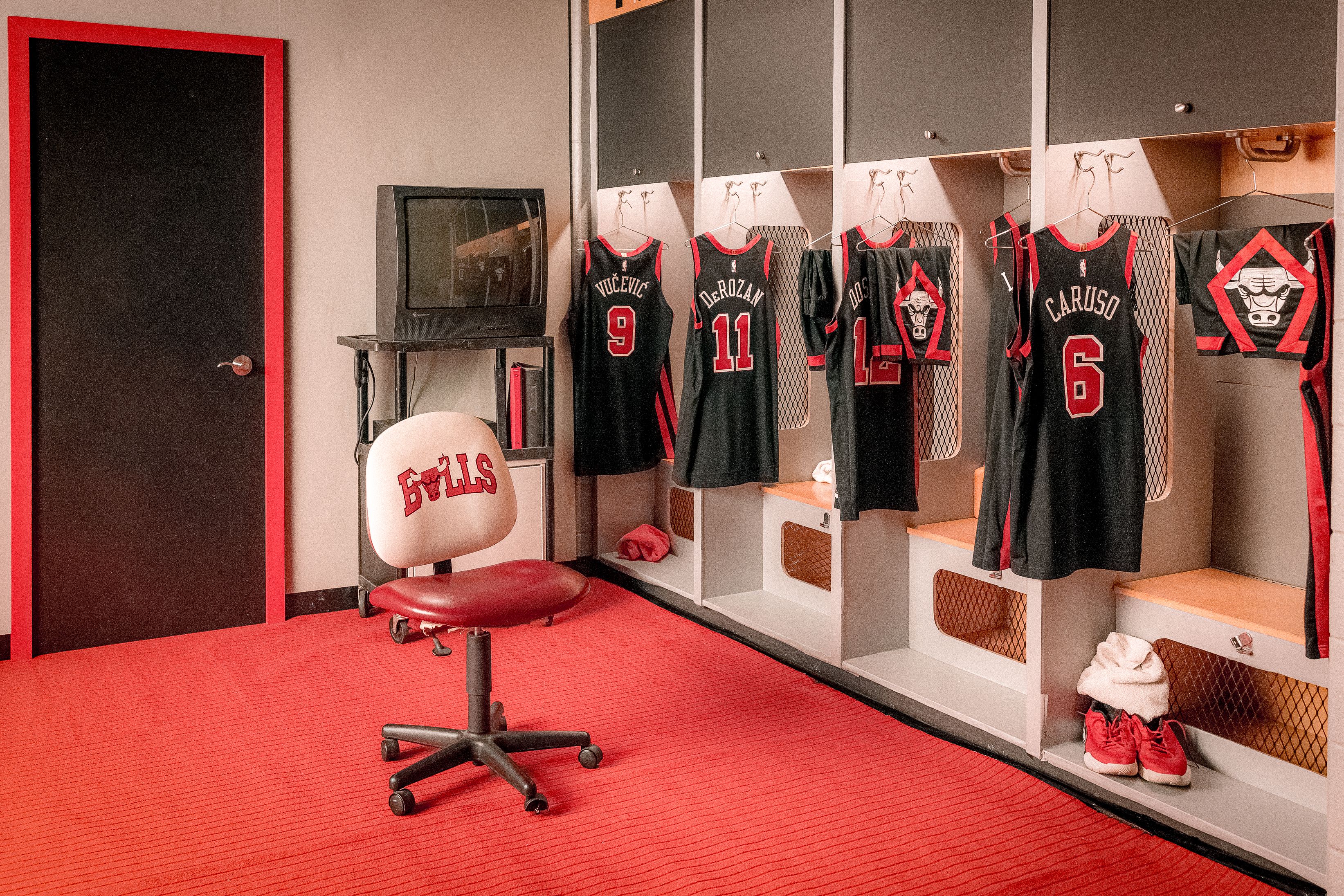 Photo of jerseys hanging in locker room 