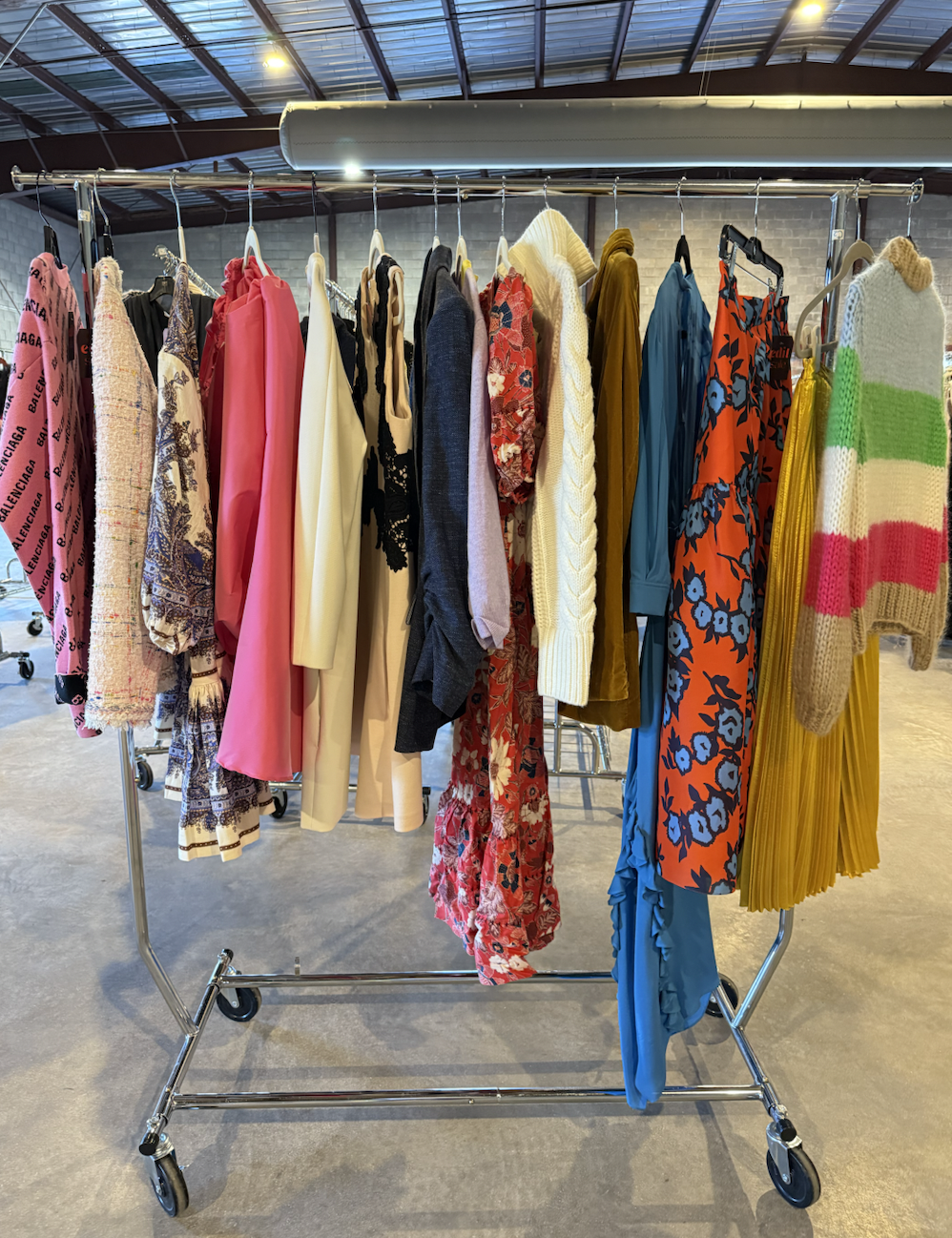clothing rack with colorful sweaters and dresses in raleigh nc