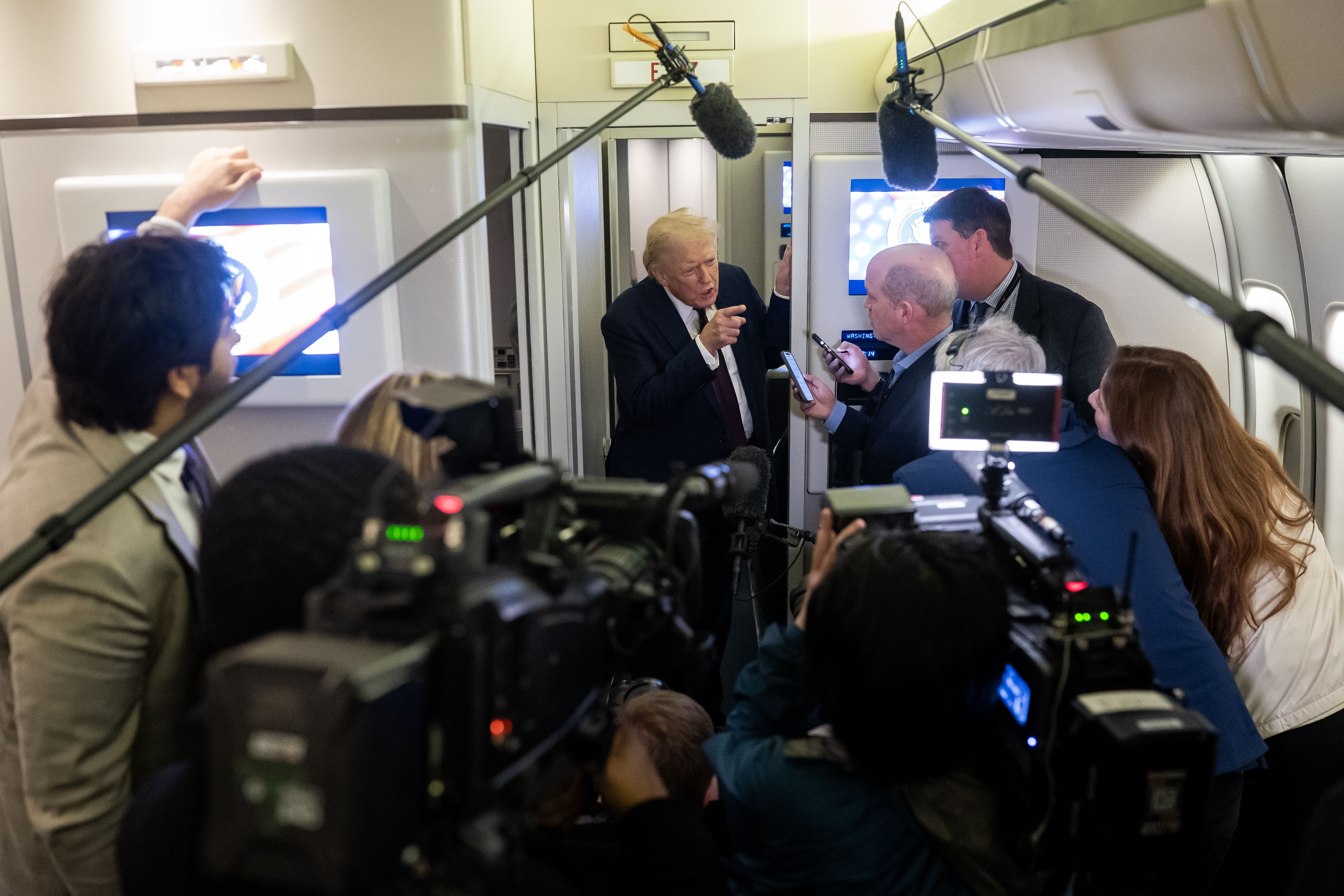 President Trump speaks to the press on Air Force One en route to Washington from Palm Beach last night.