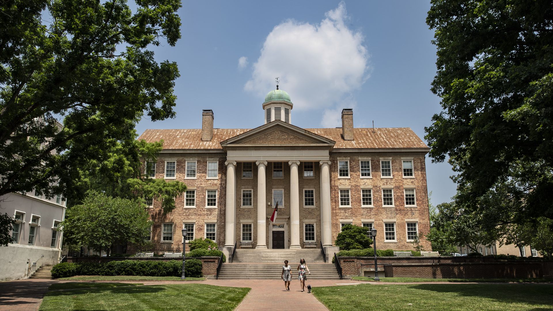 CHAPEL HILL, NORTH CAROLINA - JUNE 29: People walk on the campus of the University of North Carolina Chapel Hill on June 29, 2023 in Chapel Hill, North Carolina. The U.S. Supreme Court ruled that race-conscious admission policies used by Harvard and the University of North Carolina violate the Const