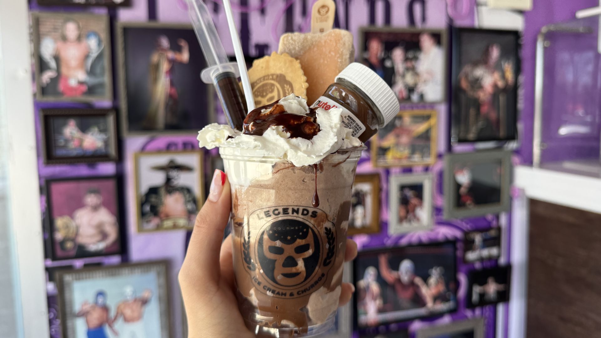 hand holding ice cream cup