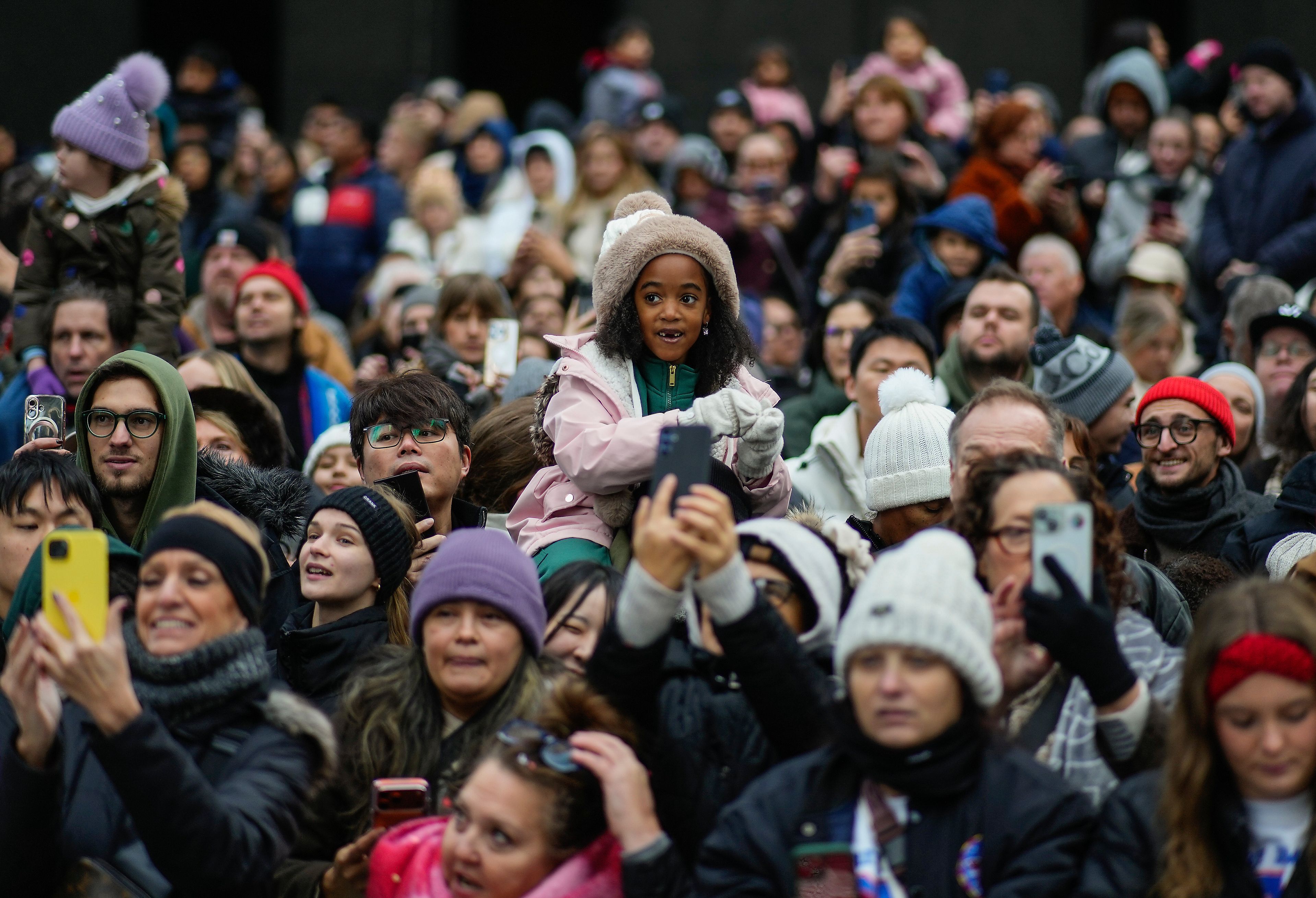 Spectators line Sixth Avenue during the Macy's Thanksgiving Day Parade, Thursday, Nov. 27, 2025, in New York. (AP Photo/Eduardo Munoz Alvarez)