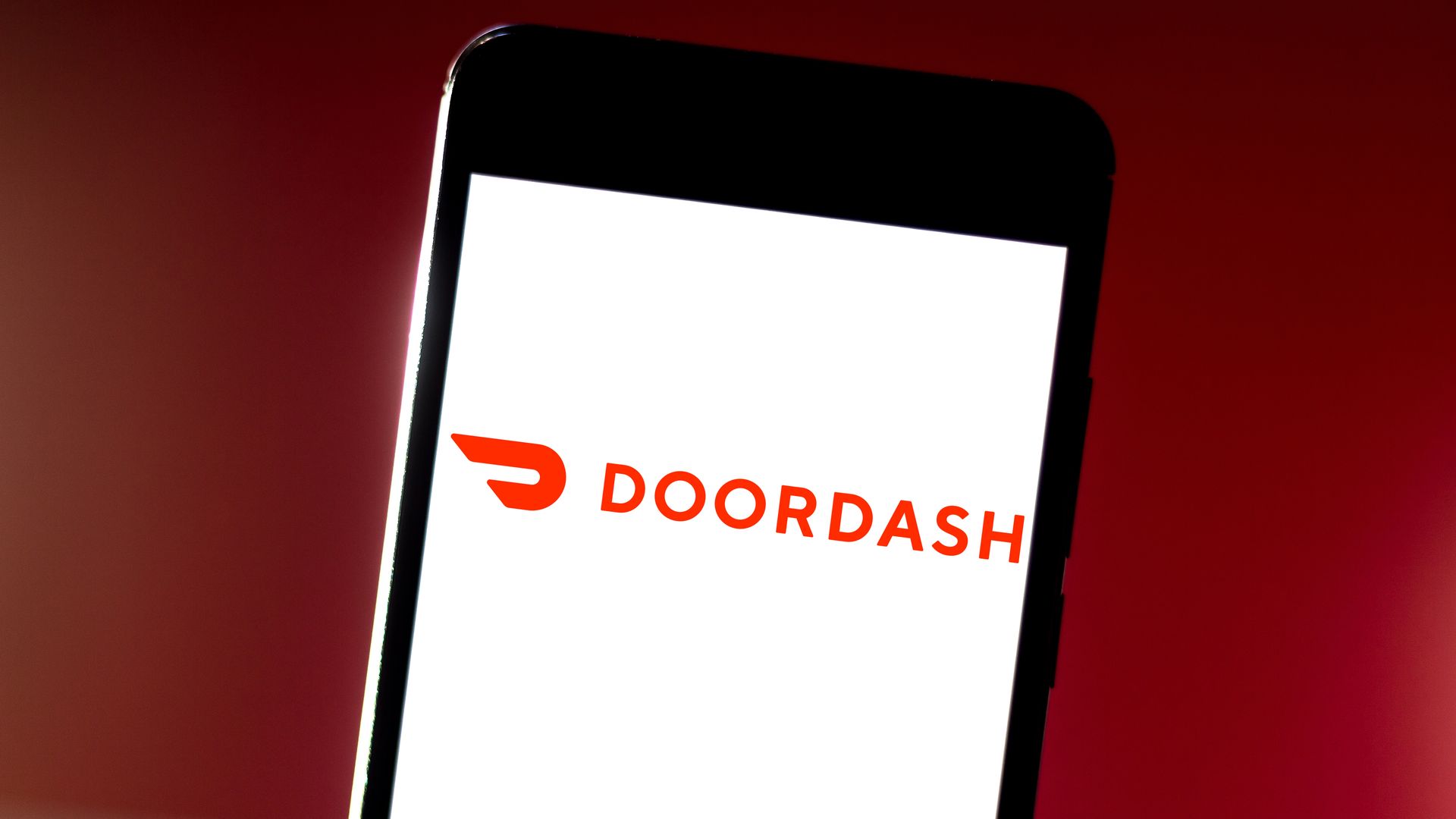 An iphone screen with the DoorDash logo.