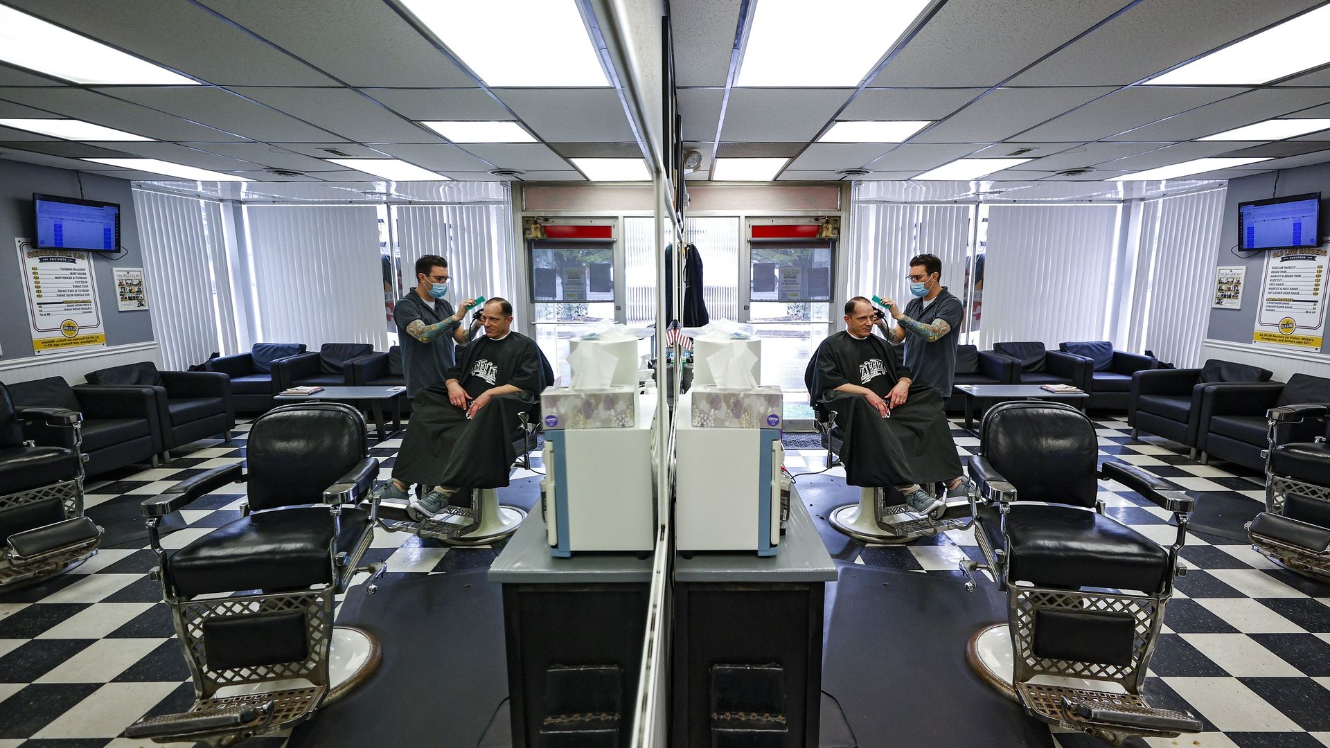 Maryland State Police Detective Steve Dulski gets a trim at Old Line Barbers in Bel Air after Gov. Larry Hogan let essential employees get haircuts.
