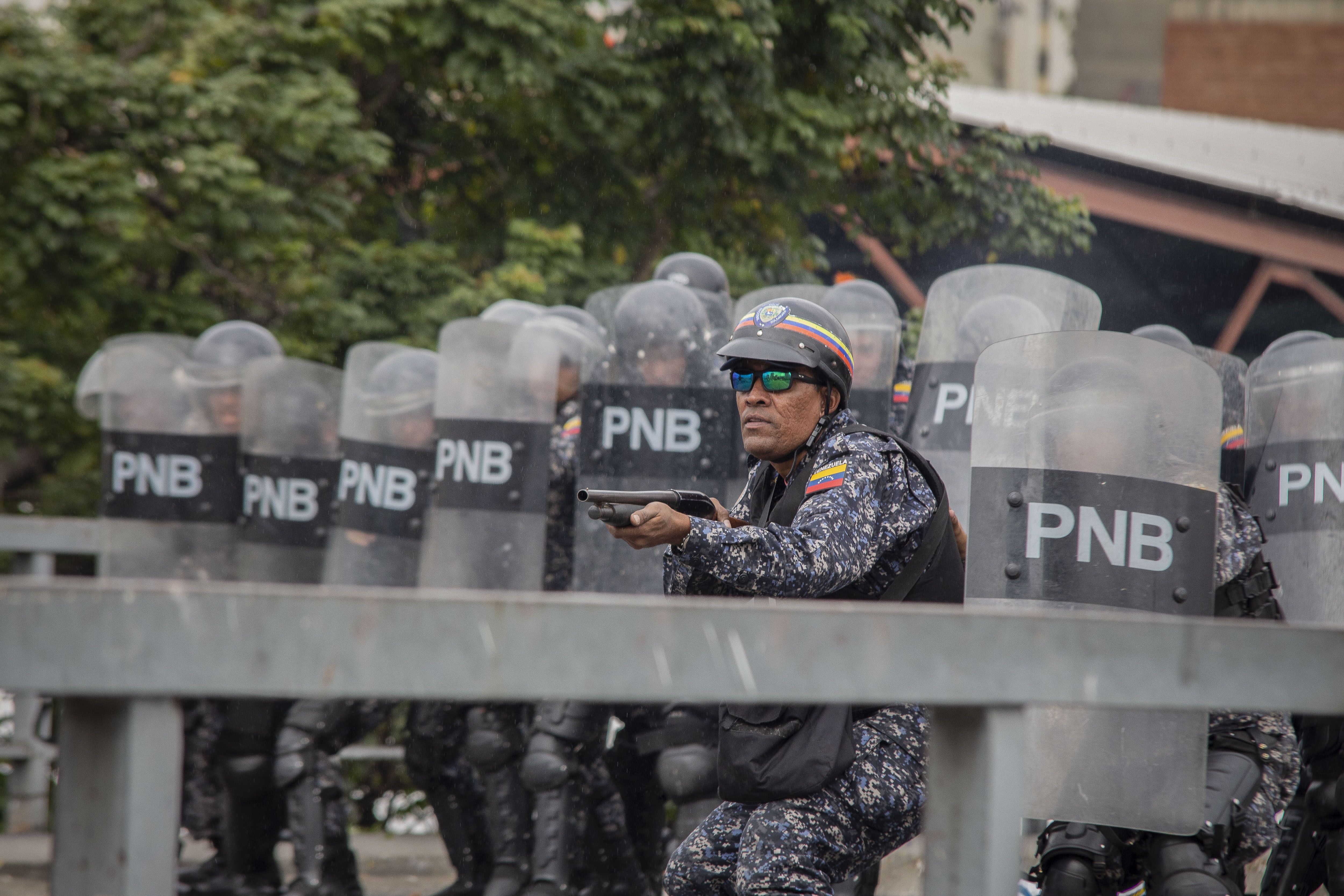 Soldiers with riot gear.