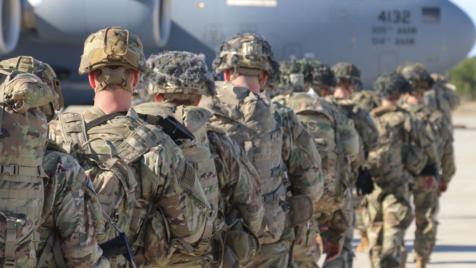 Troops boarding a plane. 
