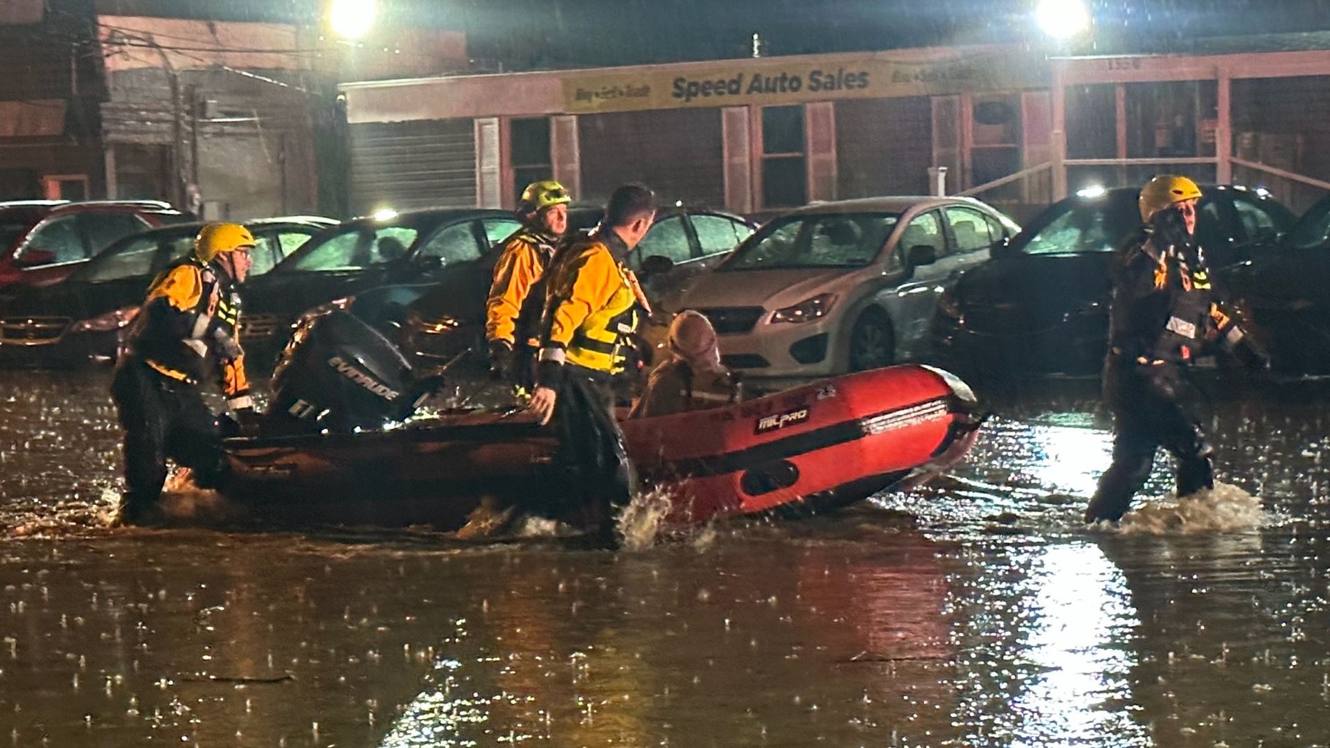 Pittsburgh rescue crews take a dinghy out into the street to save a woman trapped in a car sinking in rising waters on Route 51. Swiftwater Rescue Paramedics accessed the patient and loaded her into the boat, taking her to safety at a nearby business.