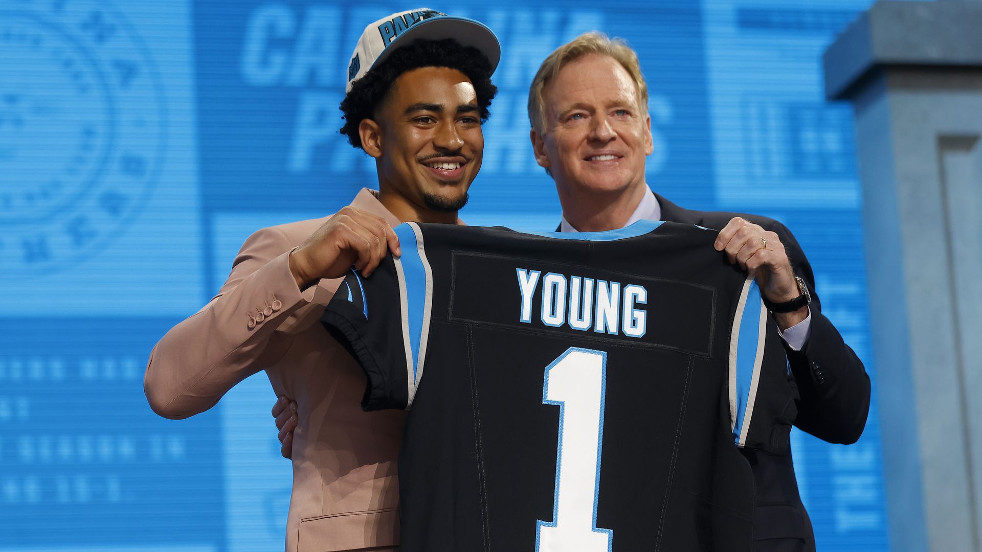 Bryce Young poses with NFL Commissioner Roger Goodell after being selected first overall by the Carolina Panthers during the first round of the 2023 NFL Draft.