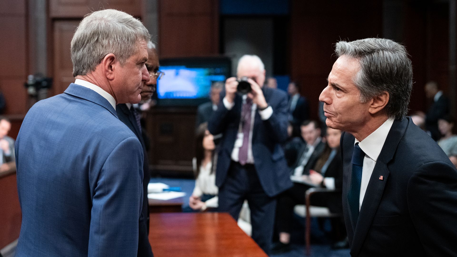 Chairman Michael McCaul, R-Texas, left, and ranking member Gregory Meeks, D-N.Y., speak with Secretary of State Antony Blinken during the House Foreign Affairs Committee hearing