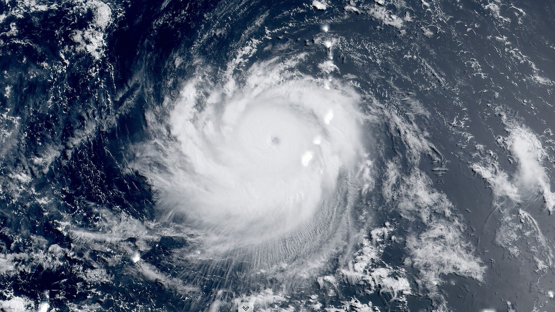 A satellite image of Super Typhoon Mawar as it pulls away from Guam.
