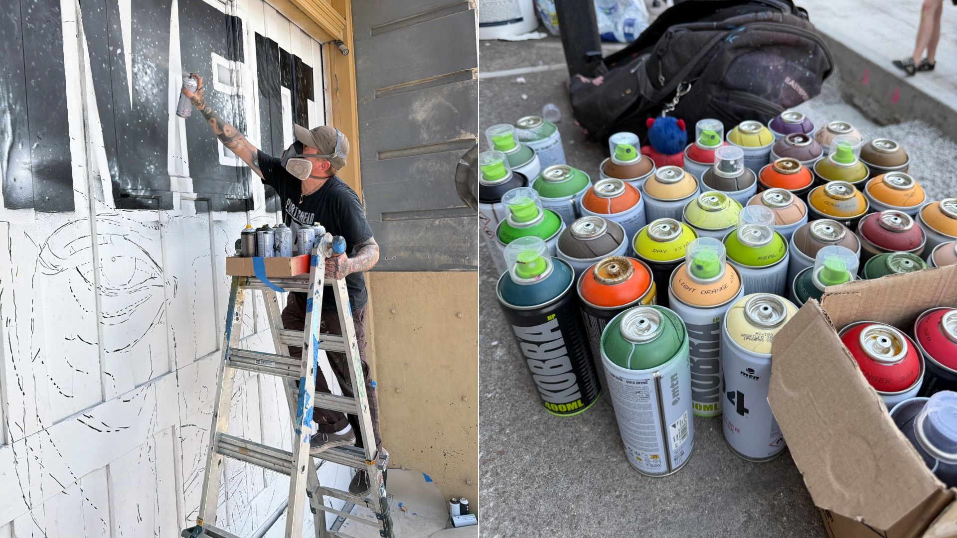 Split image: left shows a masked graffiti artist on a ladder spraying black lines on a white wall; right shows a box of many colorful spray cans (greens, oranges, yellows) on the pavement beside a backpack.